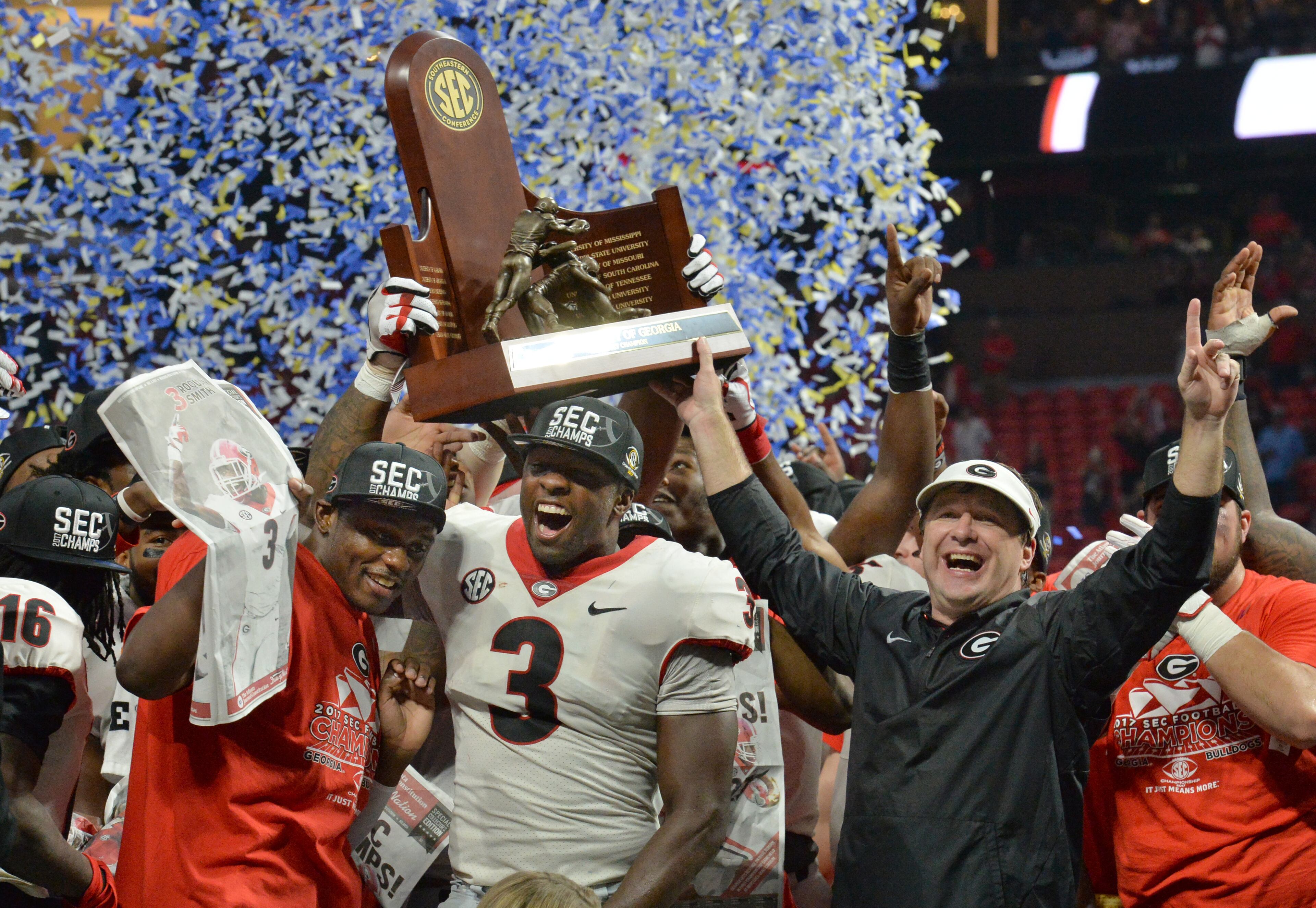 December 2, 2017 Atlanta: Georgia Bulldogs linebacker Roquan Smith (3), head coach Kirby Smart, and Georgia teammates celebrate after defeating the Auburn Tigers 28-7 during the Southeastern Conference championship NCAA college football game at Mercedes-Benz Stadium, December 2, 2017, in Atlanta. Hyosub Shin / hshin@ajc.com