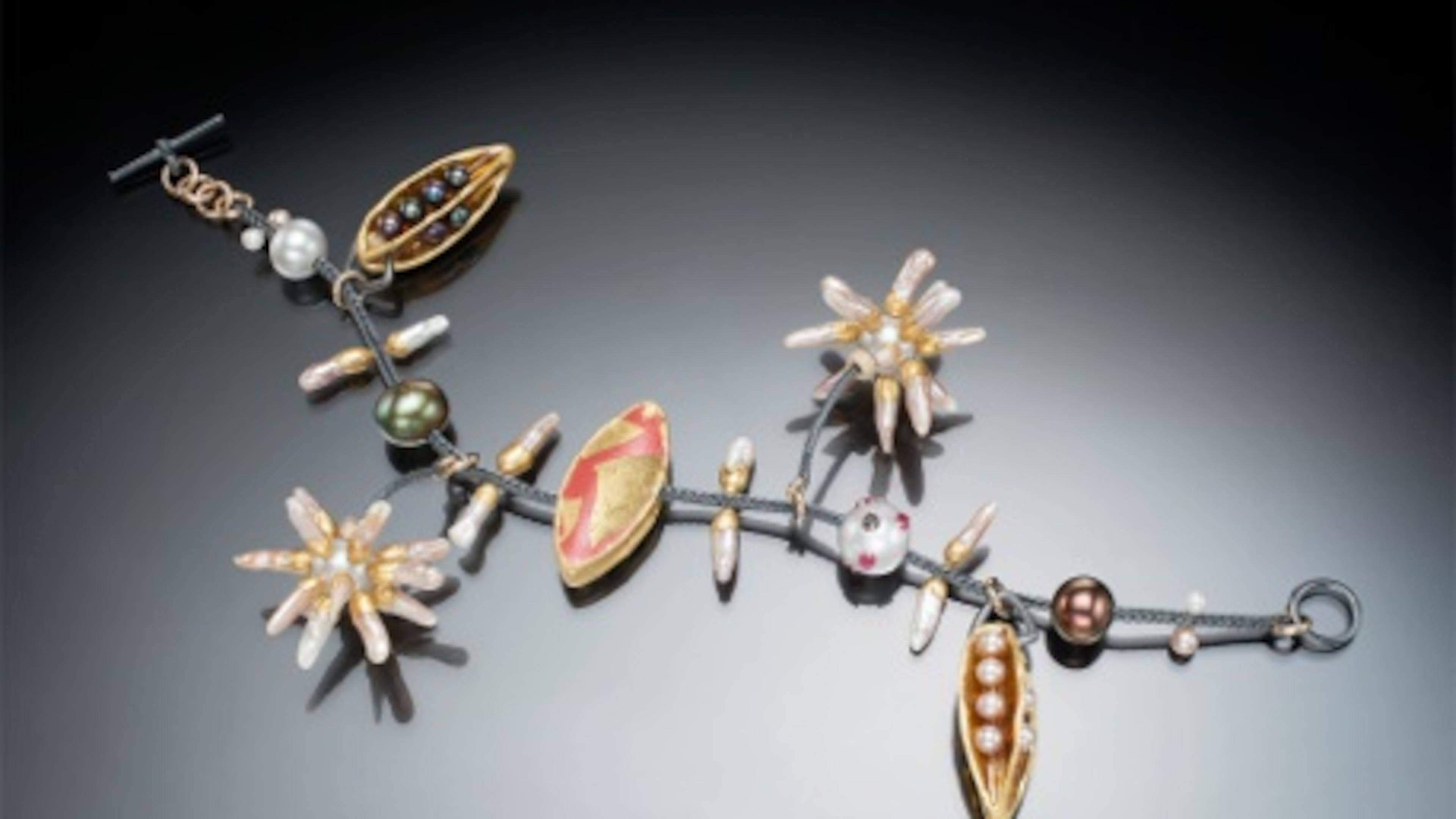 Charm bracelet by New York jewelry maker Keith Lewis.