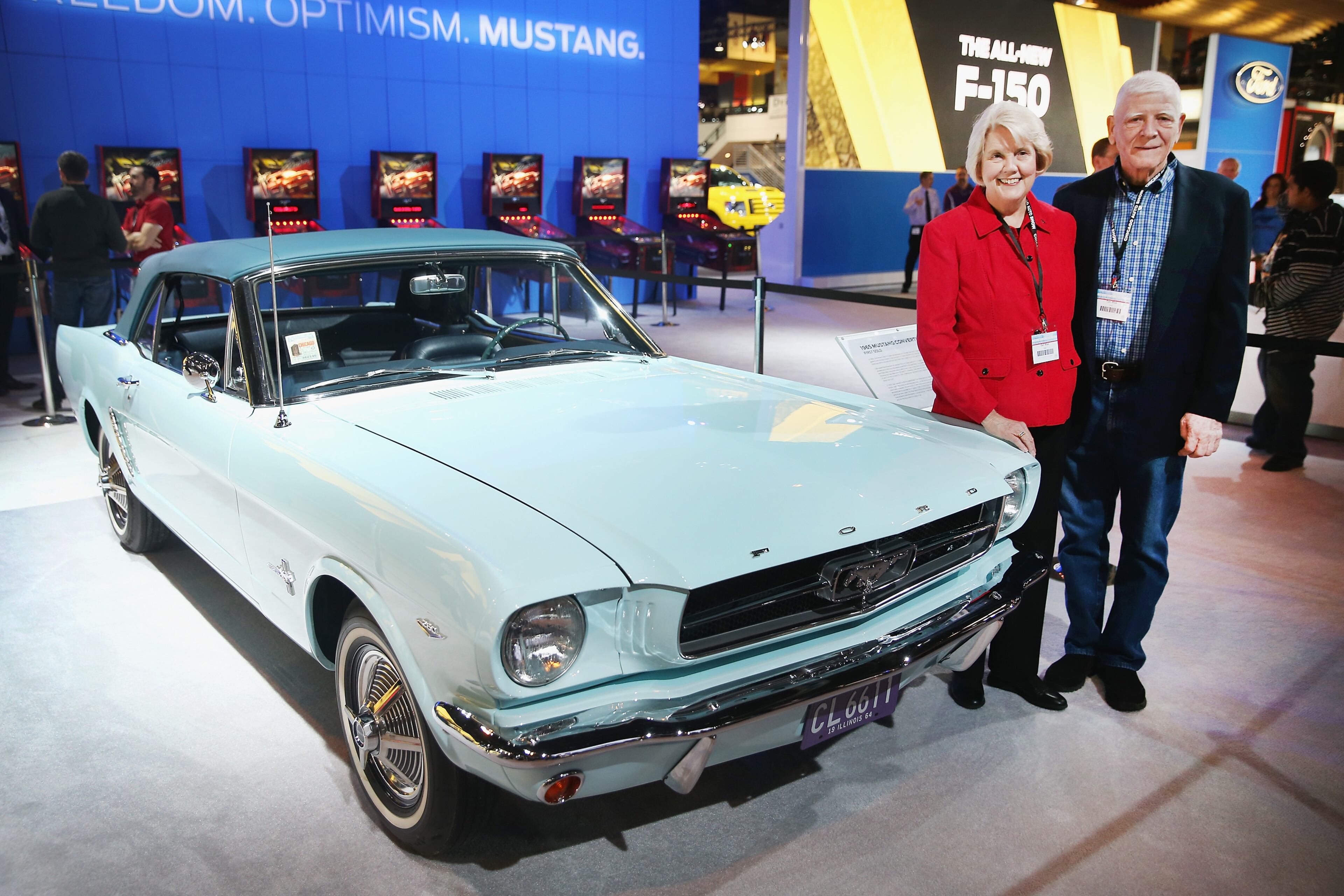 CHICAGO, IL - FEBRUARY 07: Tom and Gail Wise pose with their 1965 Mustang in the Ford exhibit at the Chicago Auto Show on February 7, 2014 in Chicago, Illinois. The car is the first of the iconic Mustang automobiles to be sold in the United States. Gail purchased the car new in Chicago after graduating from college for $3,447.50. She needed the car to commute to her new $5,000-a-year job teaching third grade at a suburban school. The show, which is oldest and largest in the nation, will be open to the public February 8 through February 17. (Photo by Scott Olson/Getty Images)