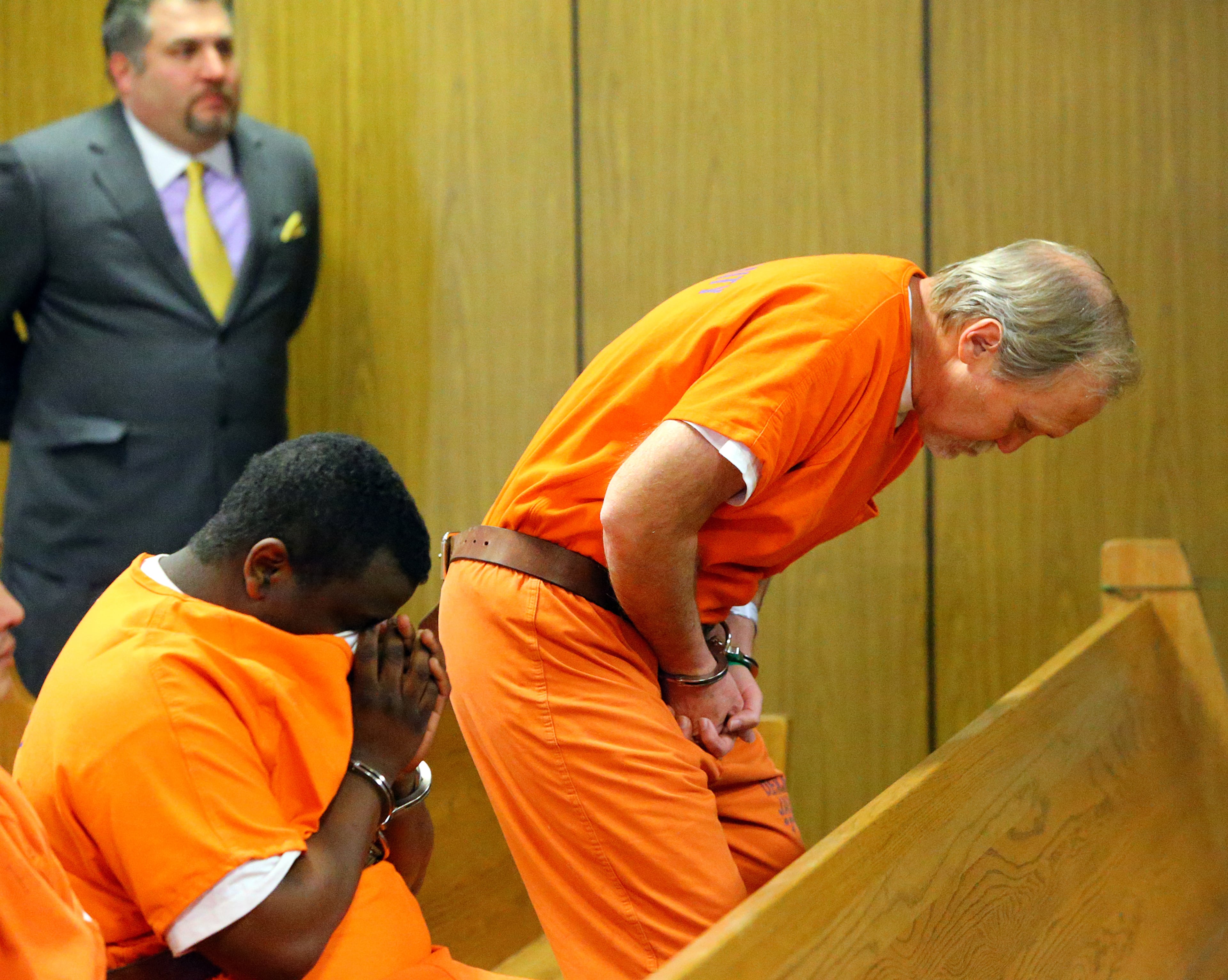 John McGill, principal of Mt. Carmel Elementary School in Douglas County, arrives for his first appearance hearing at DeKalb County Magistrate Court for a felony offense of electronic pornography and attempting to have sex with a minor with his attorney Mac Pilgrim looking on Tuesday, March 4, 2014, in Decatur.
