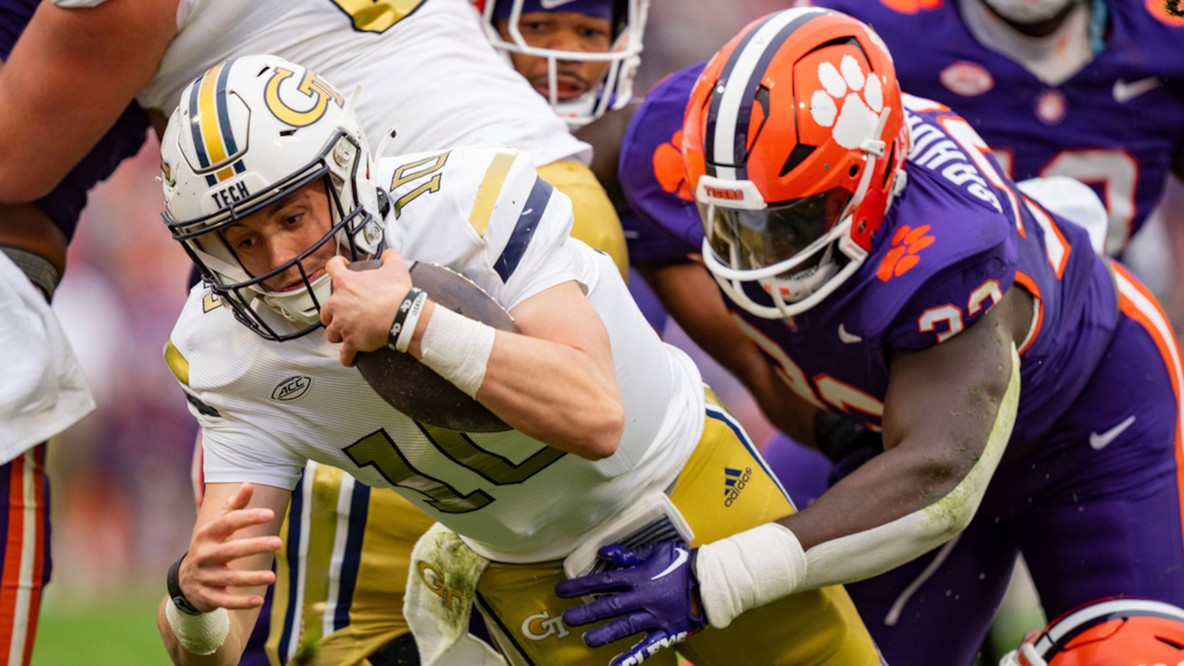 Haynes King (left), pictured diving for a touchdown against Clemson in 2023, sat out Georgia Tech's last game and it's uncertain if King will play Saturday against the Tigers. The Yellow Jackets have lost nine straight to Clemson. (Jacob Kupferman/AP 2023)