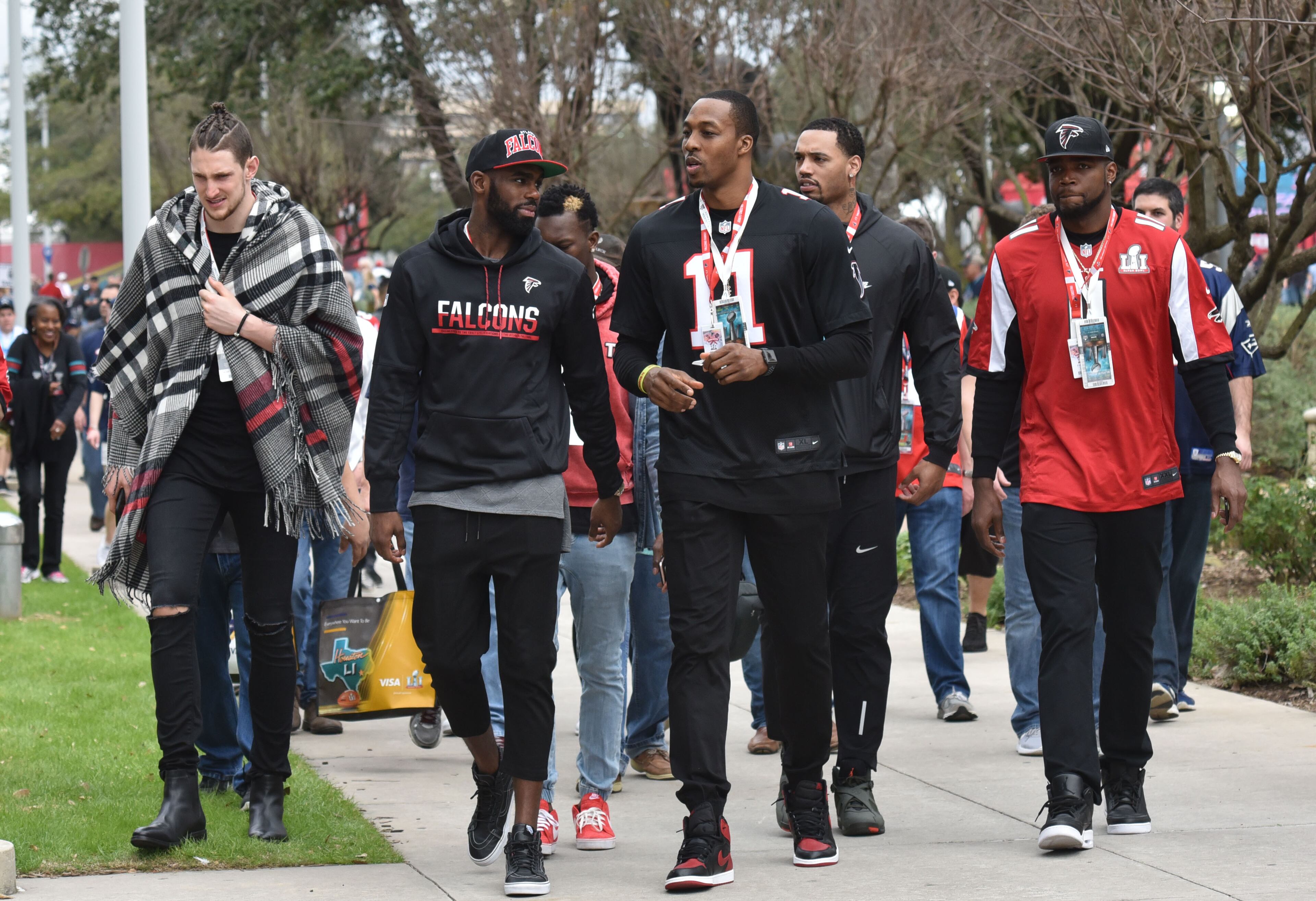 February 5, 2017 Houston, TX - Atlanta Hawks players including Dwight Howard walk in prior to Super Bowl 51 at NRG Stadium in Houston, TX, on Sunday, February 5, 2017. Fans gather outside NRG Stadium in Houston Texas before the game where the Atlanta Falcons faced the New England Patriots in Super Bowl 51. HYOSUB SHIN / HSHIN@AJC.COM