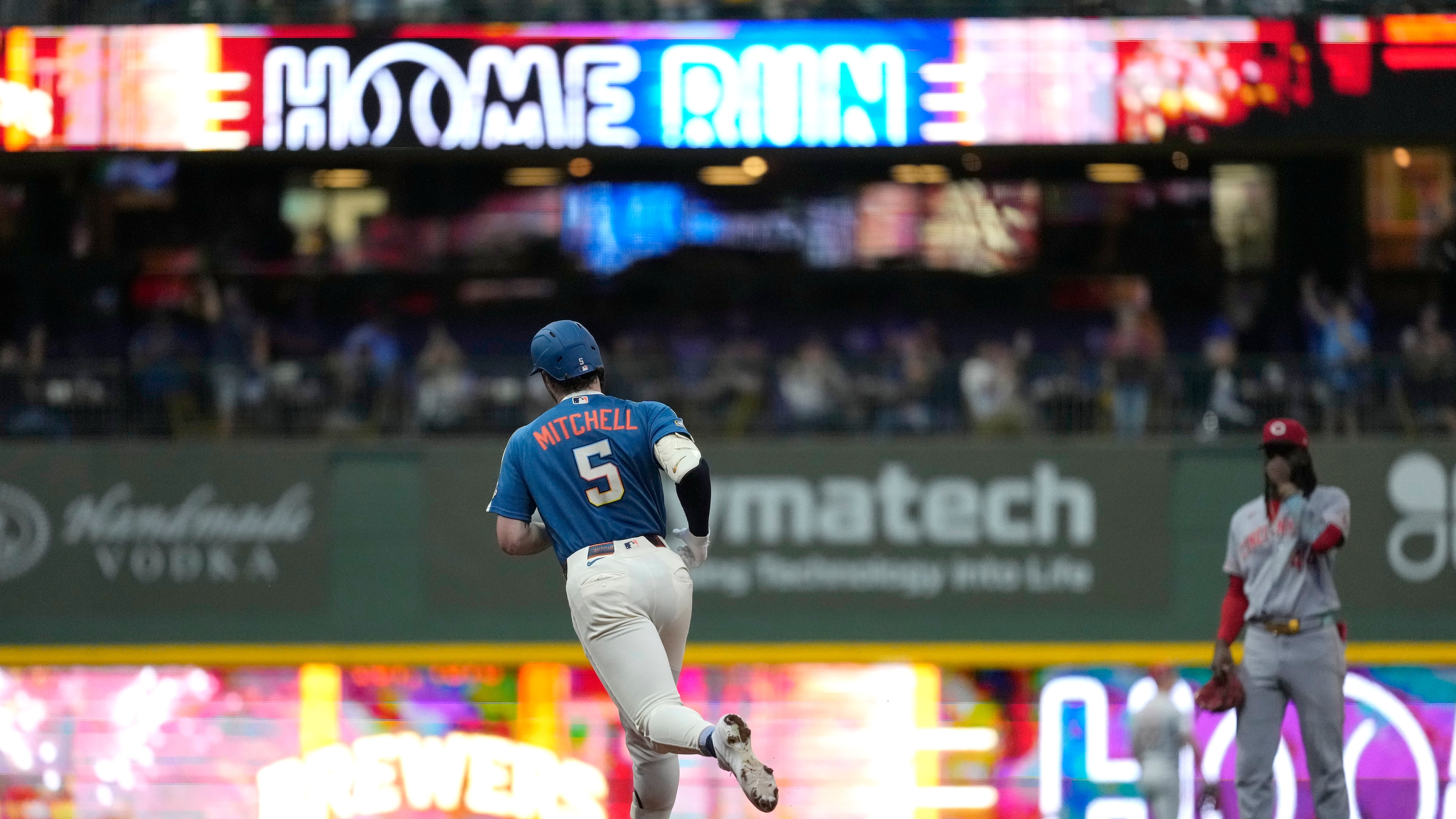 Milwaukee Brewers' Garrett Mitchell rounds the bases after hitting a grand slam during the fifth inning of a baseball game against the Cincinnati Reds, Friday, Sept. 11, 2026, in Milwaukee. (AP Photo/Aaron Gash)
