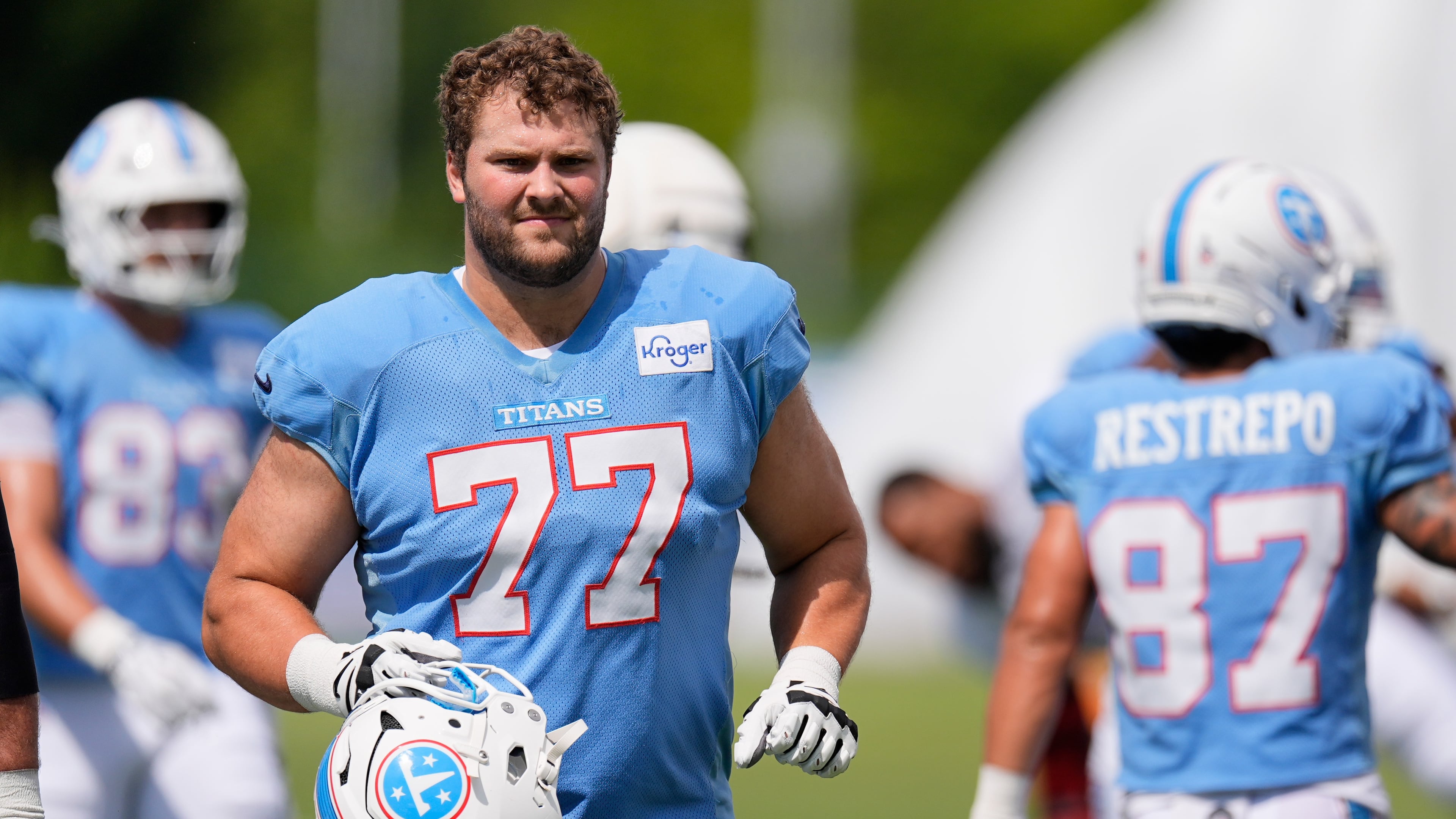 Tennessee Titans guard Peter Skoronski (77) warms up during the NFL football team's training camp Tuesday, Aug. 4, 2026, in Nashville, Tenn. (AP Photo/George Walker IV)
