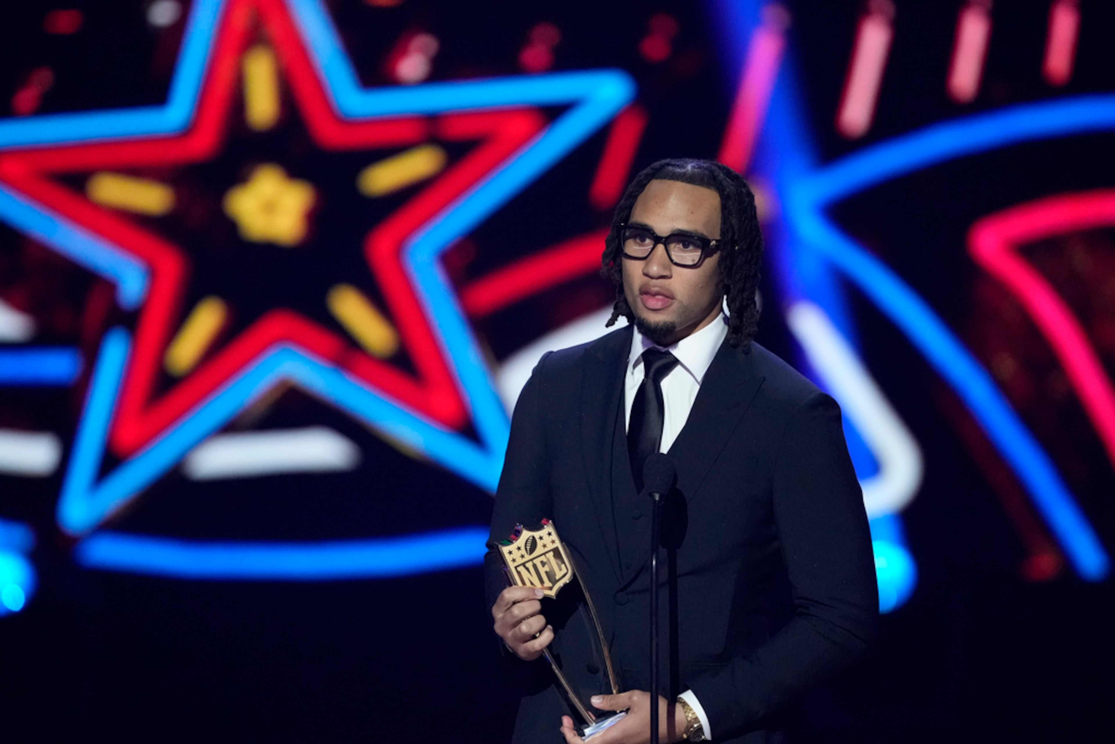 Houston Texans' C.J. Stroud, AP offensive rookie of the year speaks during the NFL Honors award show ahead of the Super Bowl 58 football game Thursday, Feb. 8, 2024, in Las Vegas. The San Francisco 49ers face the Kansas City Chiefs in Super Bowl 58 on Sunday. (AP Photo/David J. Phillip)