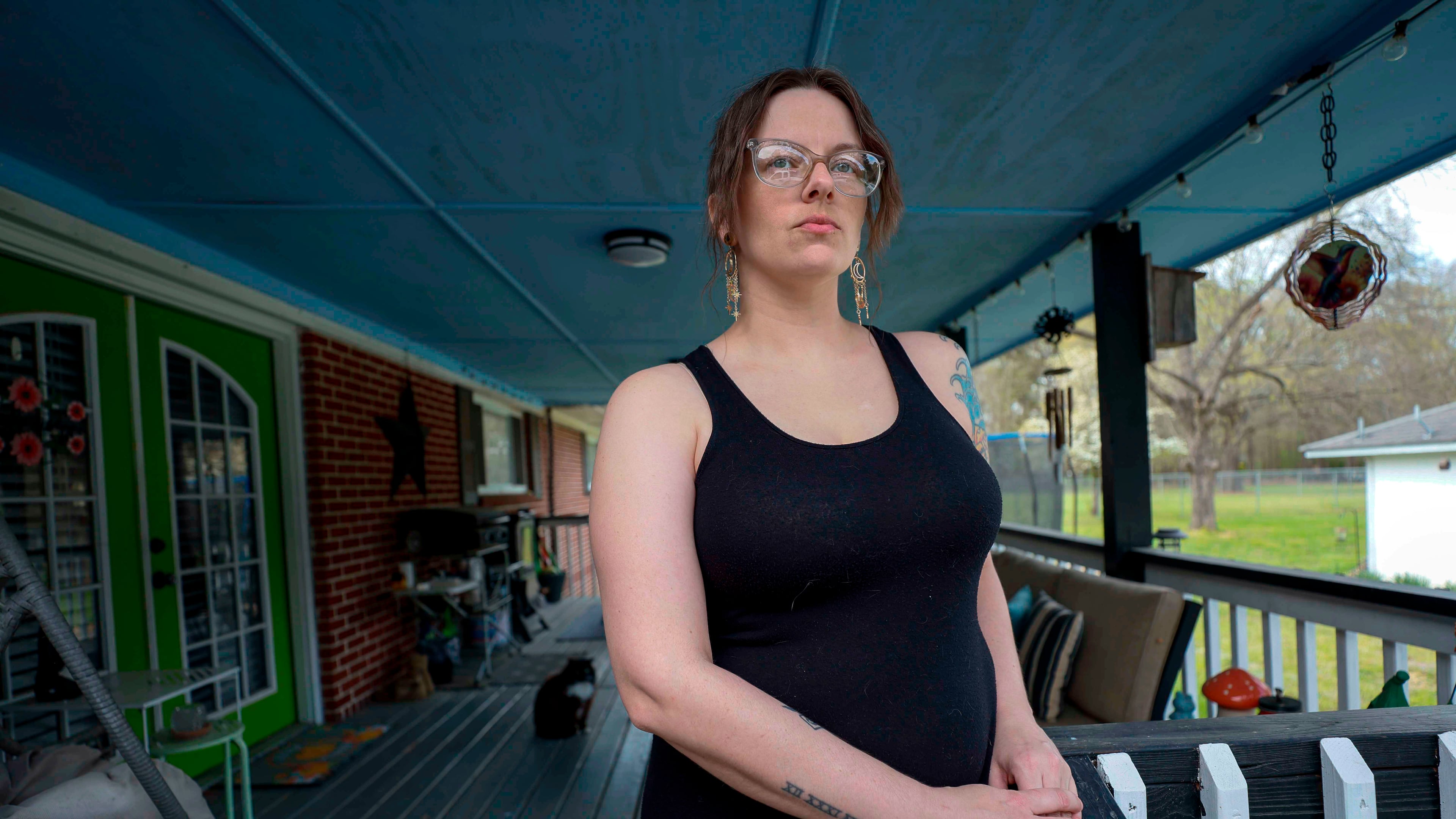 Stormy Bost stands on her porch in Calhoun, Ga., on March 29, 2026. (Miguel Martinez/Atlanta Journal-Constitution via AP)