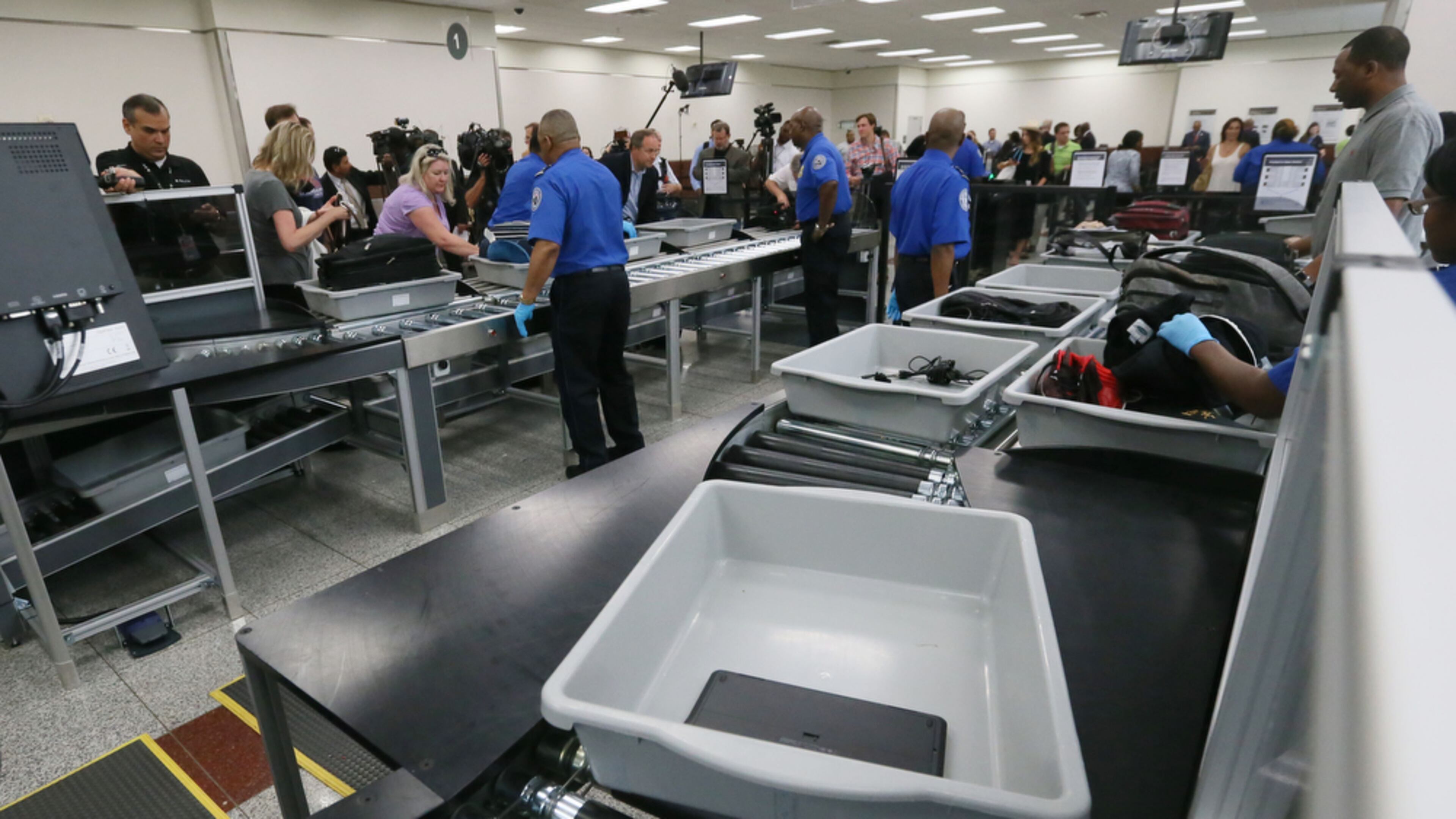 May 25, 2016 - Atlanta - Powered rollers transport bags automatically through the screening process. TSA unveiled new security "smart lanes" that have been installed in the South Security Checkpoint, which feature automated equipment that handles baggage. BOB ANDRES / BANDRES@AJC.COM
