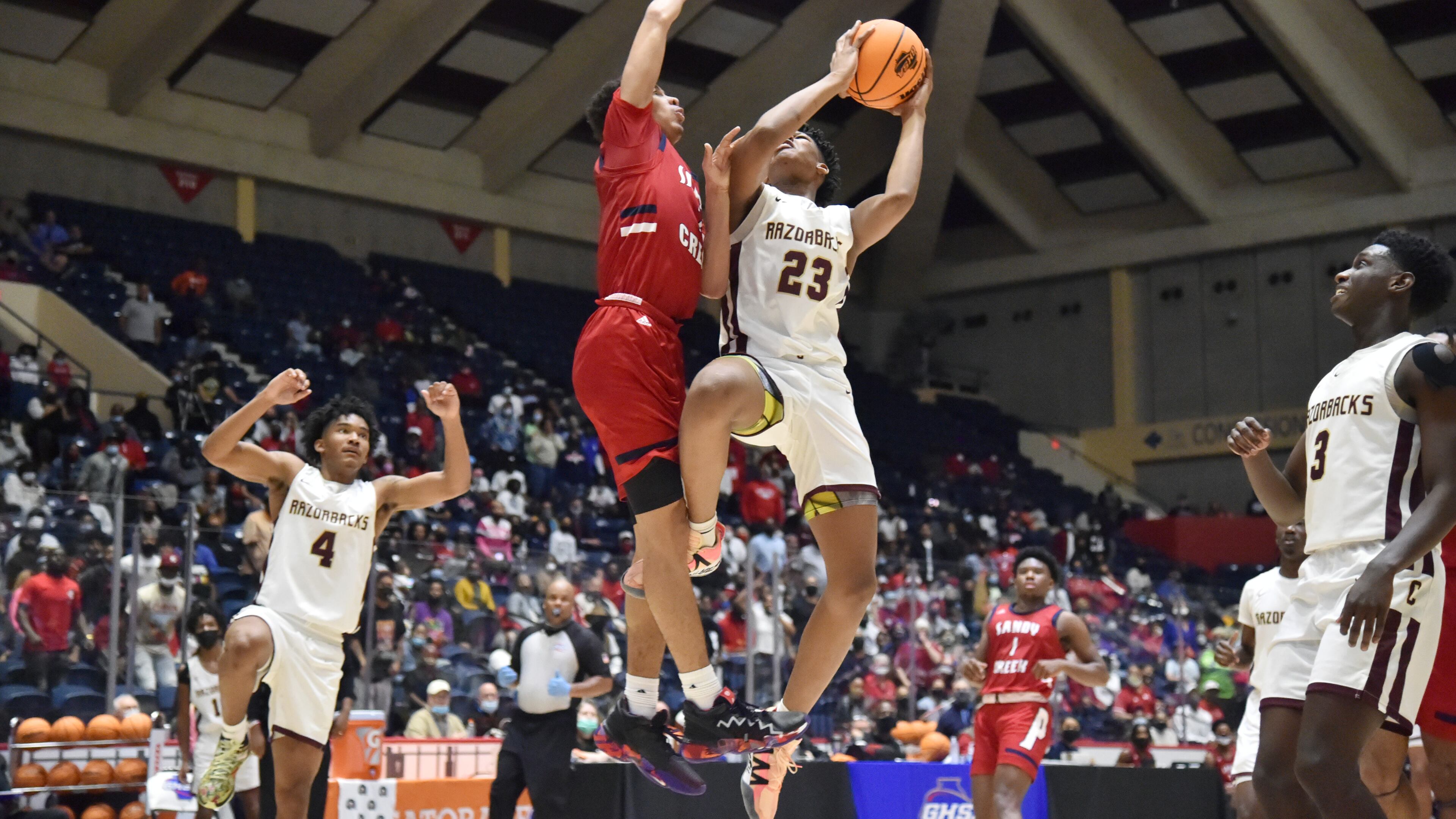 March 12, 2021 Macon - Cross Creek's Antoine Lorick (23) gets off a shot against Sandy Creek's Myles Rice (2) during the 2021 GHSA State Basketball Class AAA Boys Championship game at the Macon Centreplex in Macon on Friday, March 12, 2021 Cross Creek won 57-49 over Sandy Creek. (Hyosub Shin / Hyosub.Shin@ajc.com)