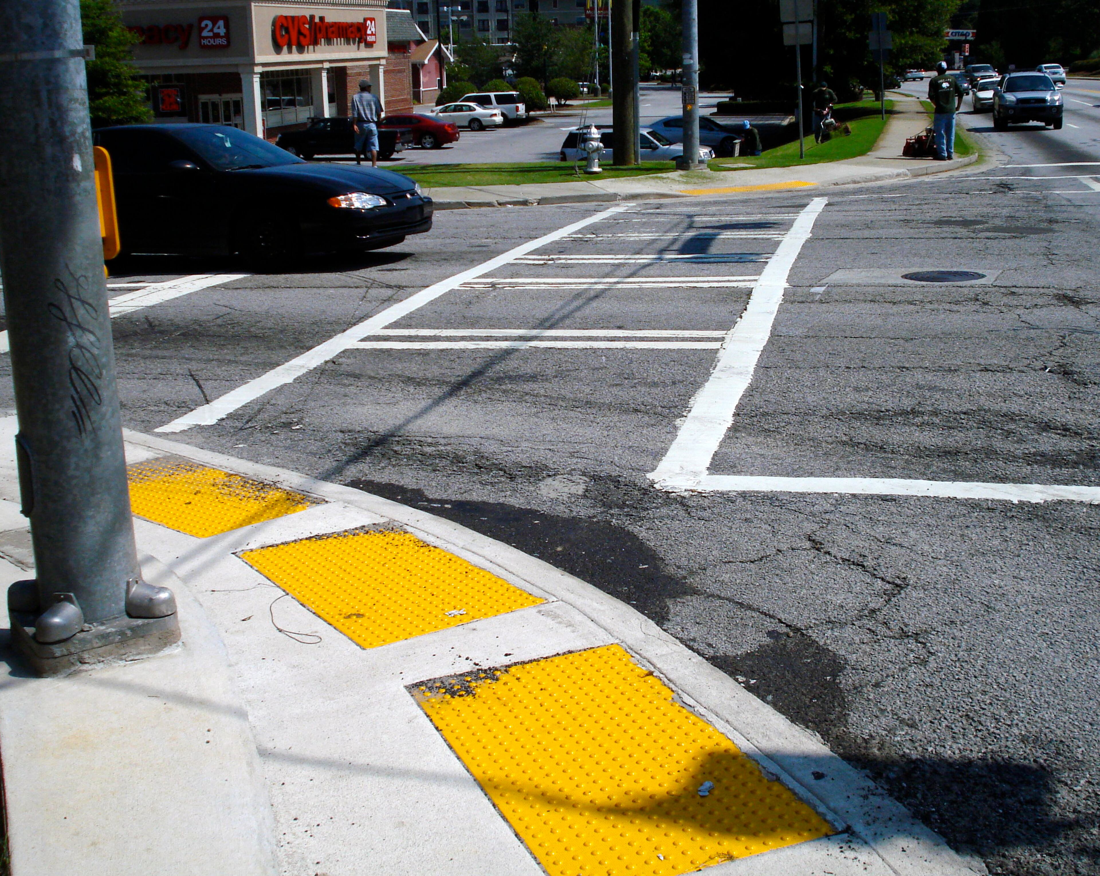 Freshly painted crosswalks and ramps to make access easier for the disabled or those with strollers were among the pedestrian improvements made at the intersection of LaVista and Cheshire Bridge roads. John Becker