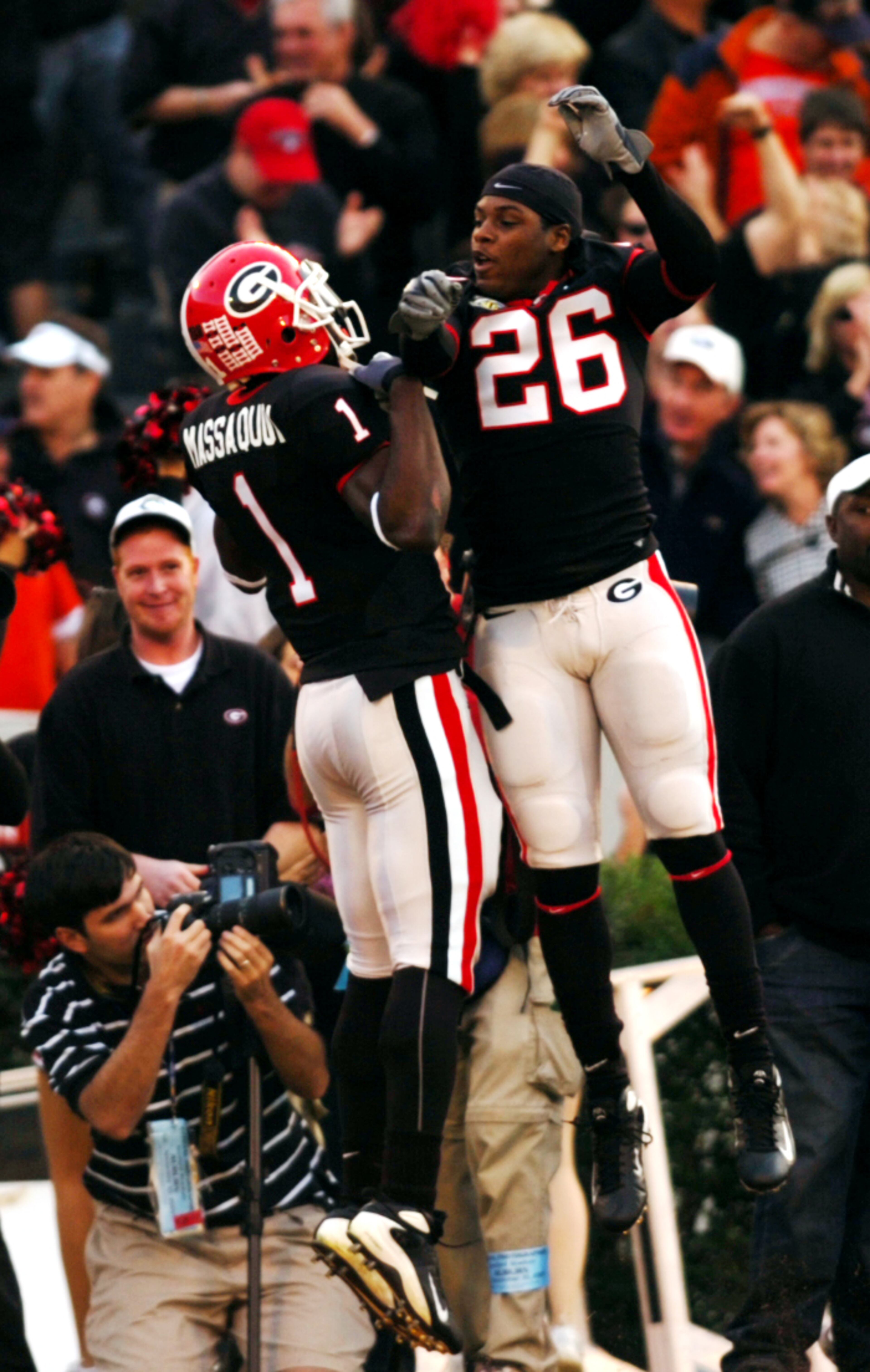 Georgia flanker Mohamed Massaquoi (1) celebrates with Tony Wilson (26) after a touchdown against Auburn at Sanford Stadium on Saturday, Nov 10, 2007. (ELISSA EUBANKS/STAFF)