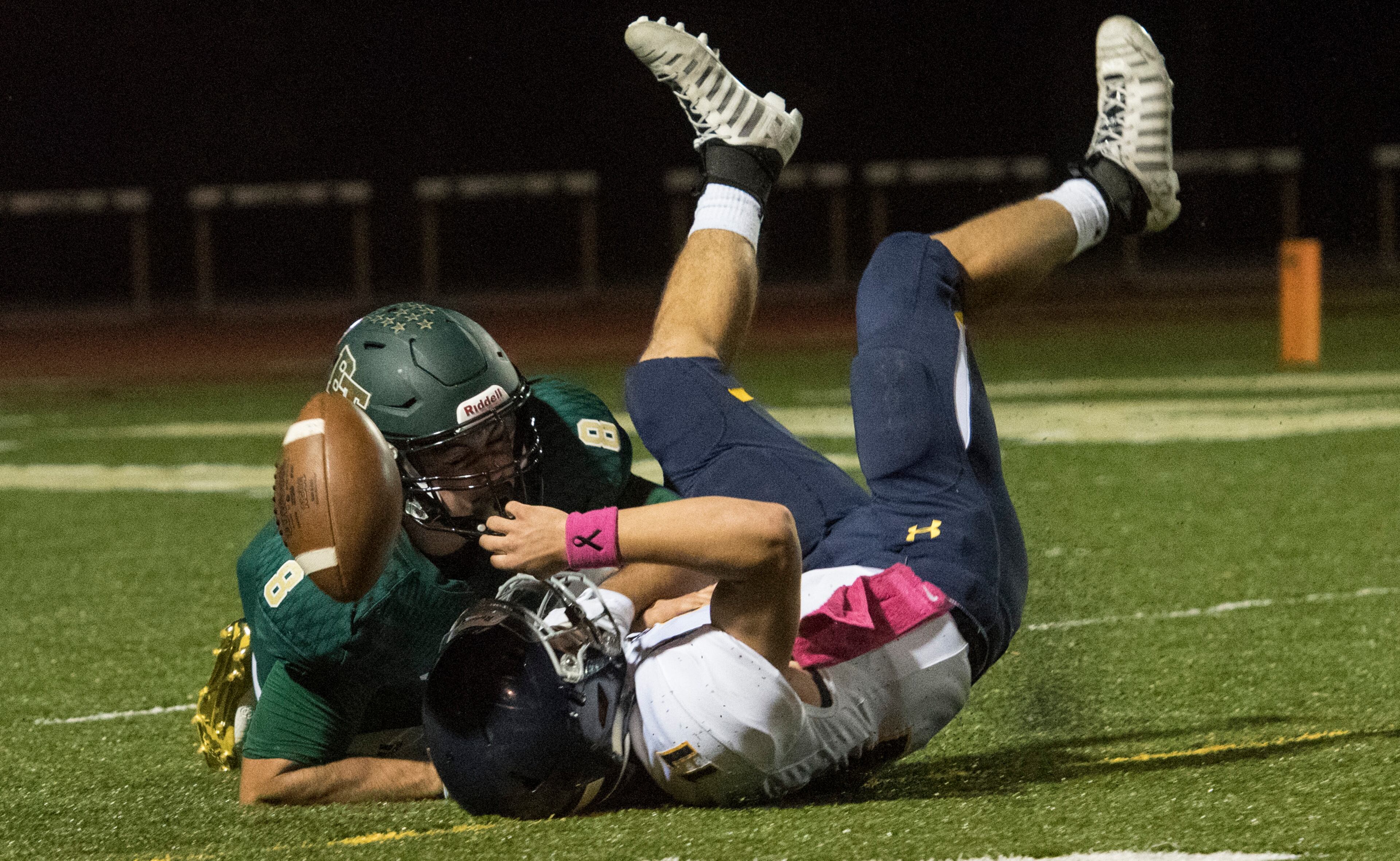 Marist QB Chase Abshier loses the ball after he is upended by Blessed Trinity defender Jr Bivens during a high school football game, Friday, Oct. 20, 2017, in Roswell. (John Amis)