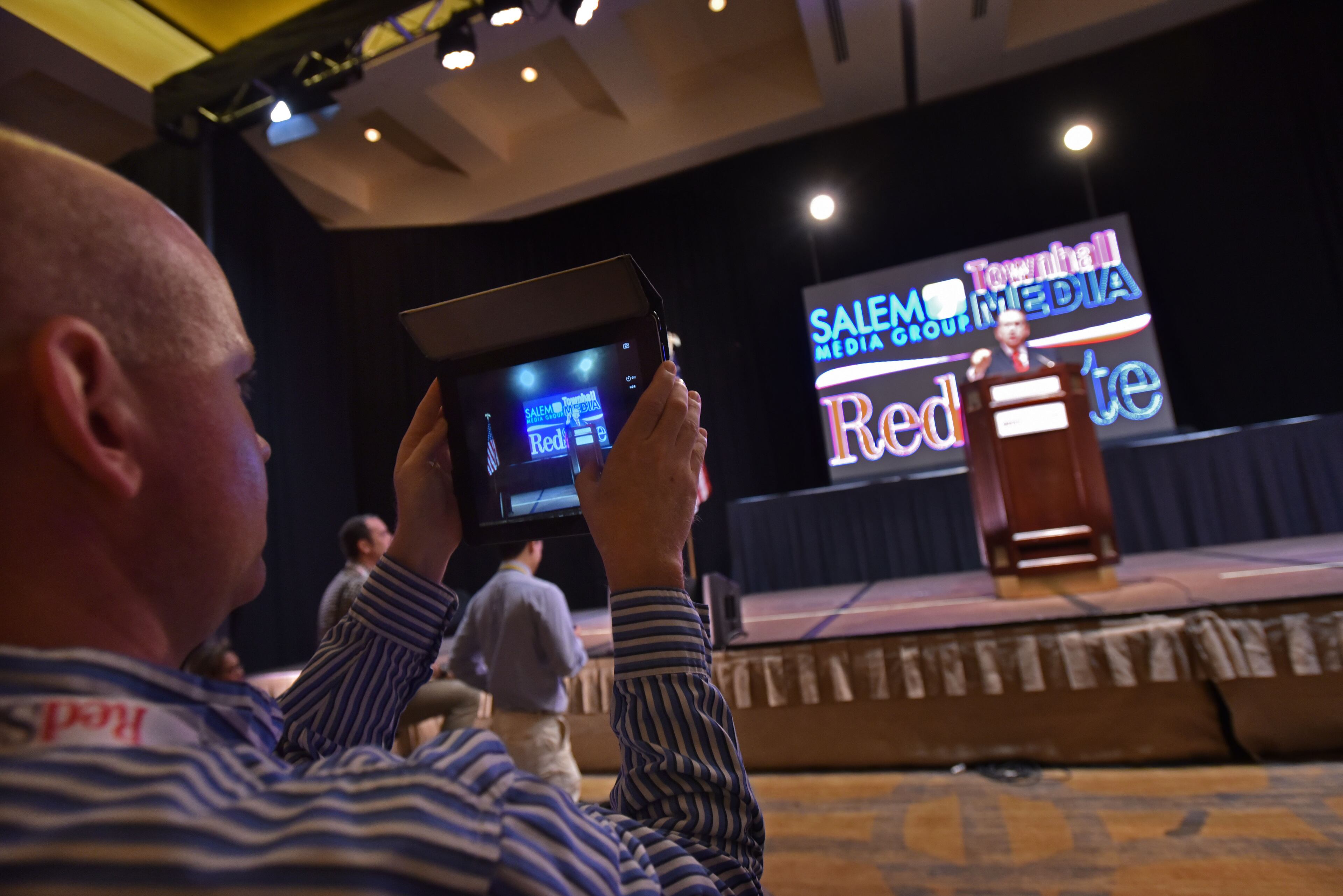 August 8, 2015 Atlanta - Attendee takes a picture of former Arkansas Gov. Mike Huckabee during the RedState Gathering at Intercontinental Buckhead Hotel on Saturday, August 8, 2015. The organizer of the RedState Gathering has rescinded the Republican presidential candidate's invitation to speak at a Saturday evening rally at the College Football Hall of Fame. Erick Erickson said the billionaire's comments about Fox News anchor Megyn Kelly were "a bridge too far." Trump told CNN on Friday that "you could see there was blood coming out of her eyes. Blood coming out of her wherever" as she questioned him during Thursday's Republican presidential debate.HYOSUB SHIN / HSHIN@AJC.COM