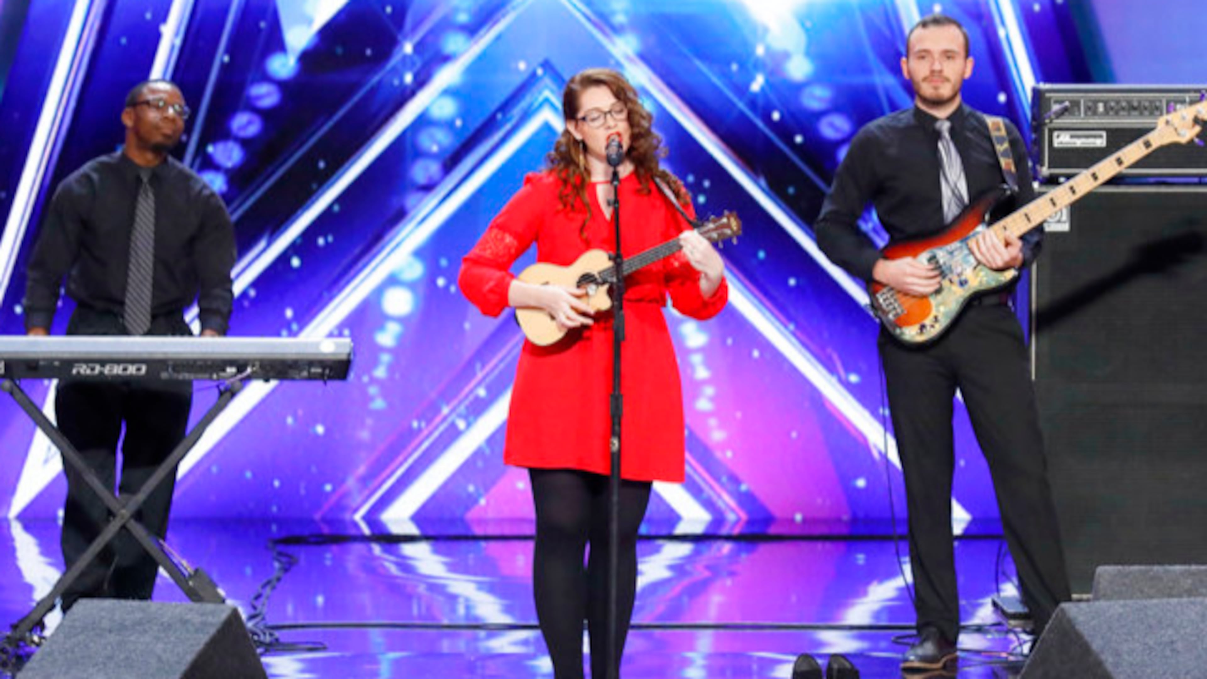 In this undated photo provided by NBC, Mandy Harvey sings during auditions for the show "America's Got Talent" in Pasadena, Calif. Harvey, a deaf singer is moving on to the semifinals of âAmericaâs Got Talentâ after delivering a performance that aired Tuesday, June 6, 2017, that judge Simon Cowell calls âone of the most amazing thingsâ heâs ever seen or heard. Mandy Harvey told the judges on the NBC reality competition that she suffers from a connective tissue disorder and she lost her hearing when she was 18. Now 29, Harvey said she taught herself to sing again using muscle memory and visual tuners. (Trae Patton/NBC via AP)