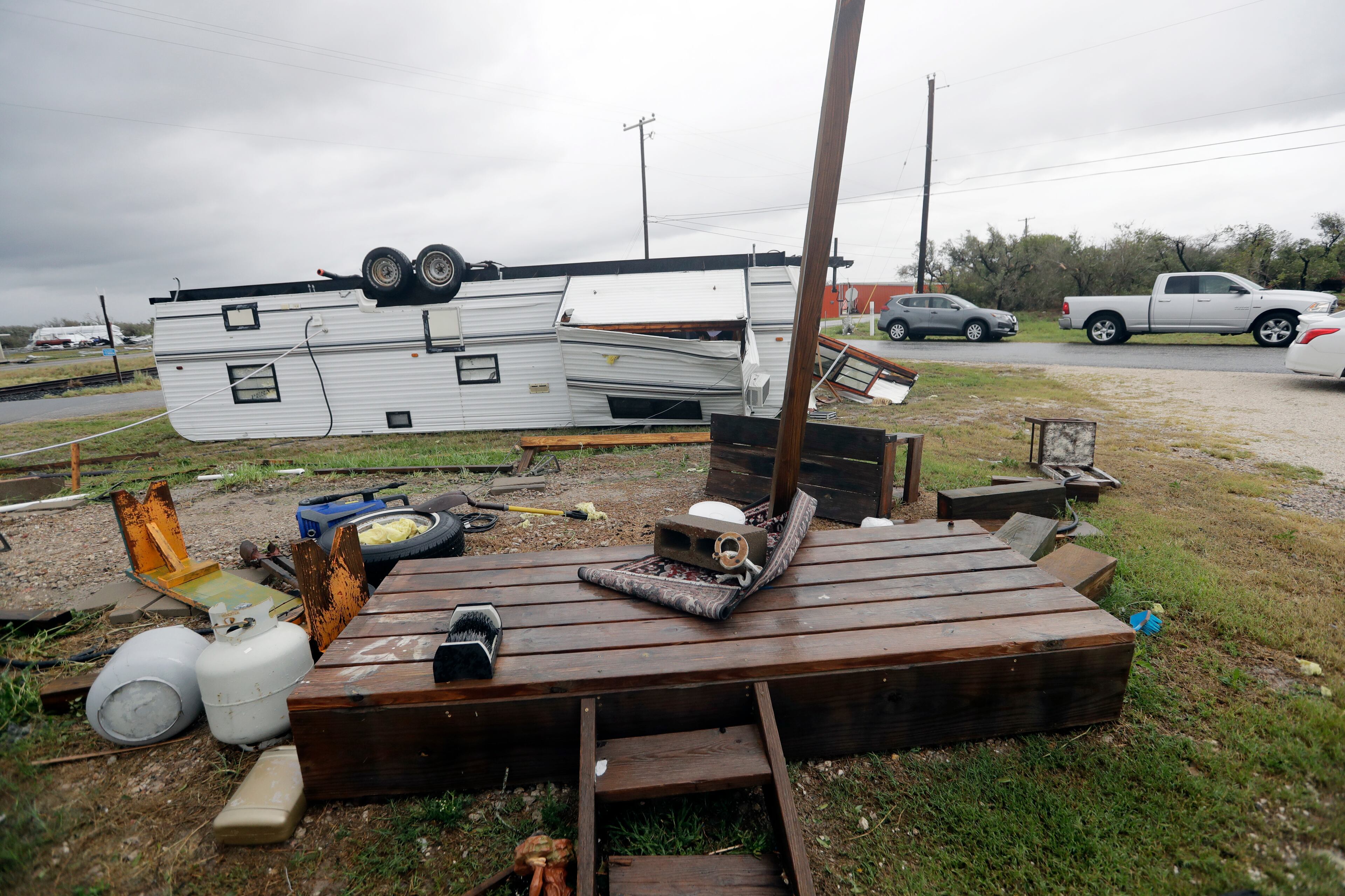 A trailer overturned in the wake of Hurricane Harvey lies upside down, Saturday, Aug. 26, 2017, in Aransas Pass, Texas. Harvey rolled over the Texas Gulf Coast on Saturday, smashing homes and businesses and lashing the shore with wind and rain so intense that drivers were forced off the road because they could not see in front of them. (AP Photo/Eric Gay)