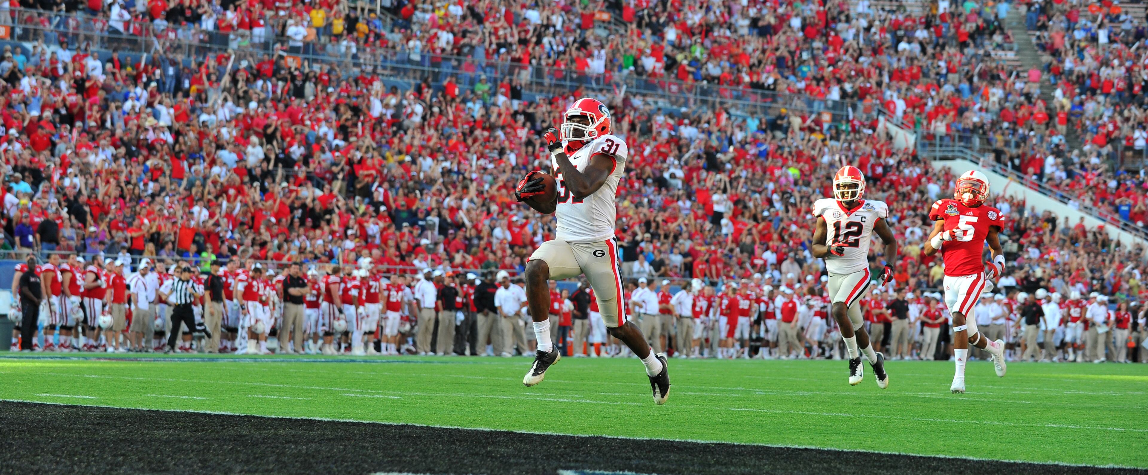 January 1, 2013 Orlando, FL: Georgia Bulldogs wide receiver Chris Conley scores the on a 87 yard Aaron Murray pass to put the Bulldogs up 41-35 Capital One Bowl in Orlando Tuesday January 1, 2013. BRANT SANDERLIN / BSANDERLIN@AJC.COM