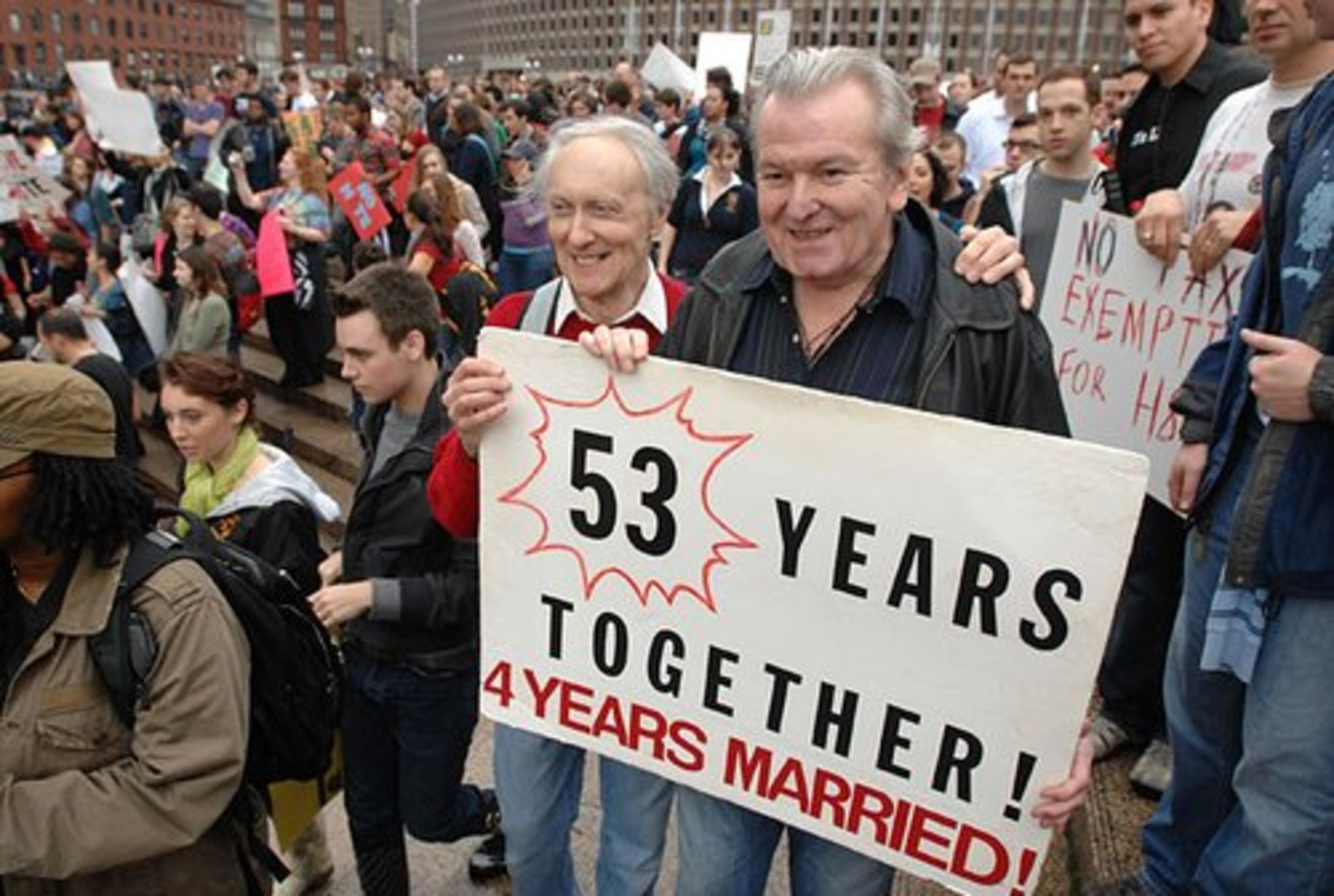 Ralph Hodgdon, 74, left, and Paul McMahon, 75, protest in Boston. The couple, who said they met in New York City in 1955 and were married in Boston in 2004.