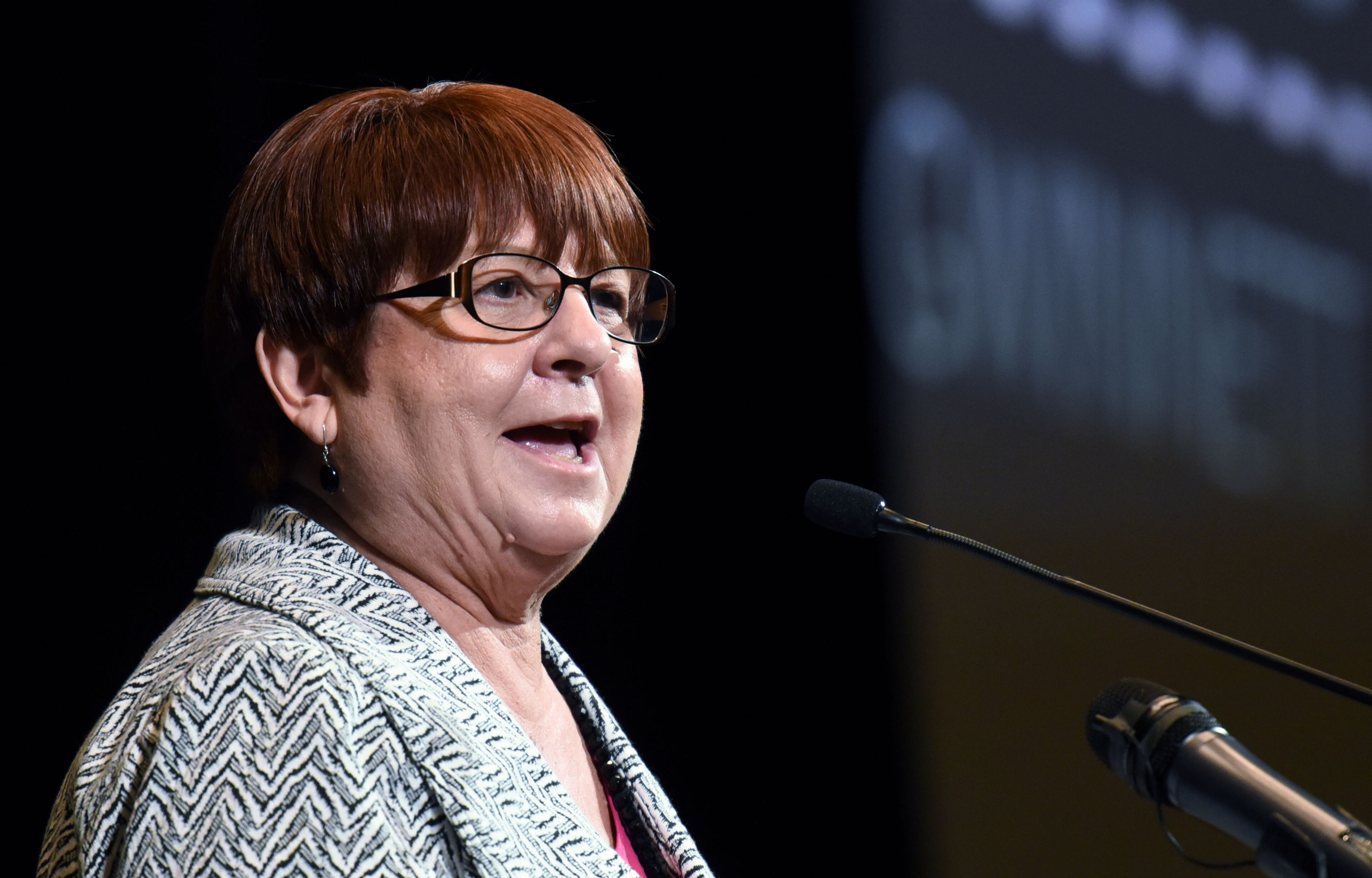 In her February 2016 “state of the county” speech, County Commission Chairman Charlotte Nash shows illustrations of Gwinnett’s future that include bus rapid transit, a kind of bus service that some see as an interim step toward rail transit.