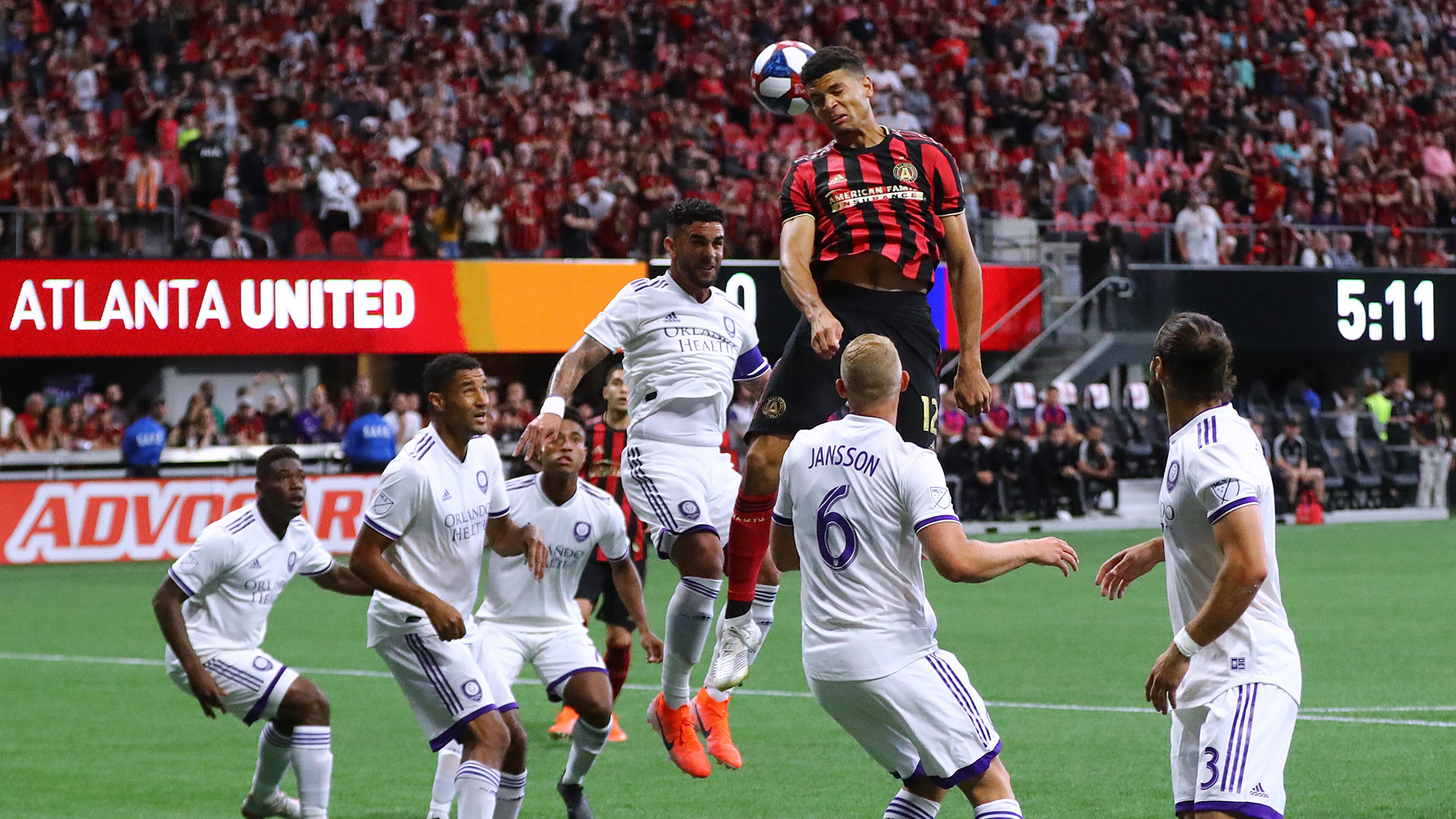 May 12, 2019 Atlanta: Atlanta United defender Miles Robinson trys to head a corner kick into the net against a host of Orlando City defenders during the first half in a MLS soccer match on Sunday, May 12, 2019, in Atlanta. Curtis Compton/ccompton@ajc.com