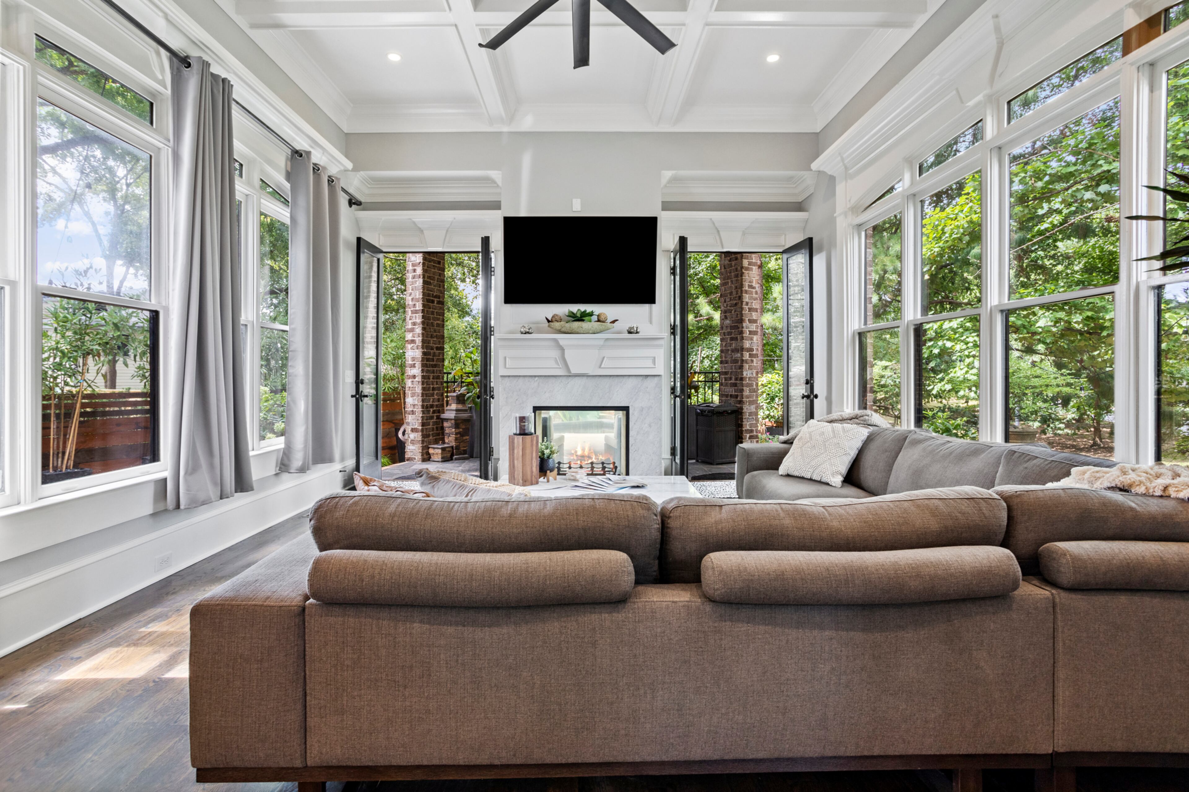 Incredible family room with wall of windows. Text by Justin Longenbach