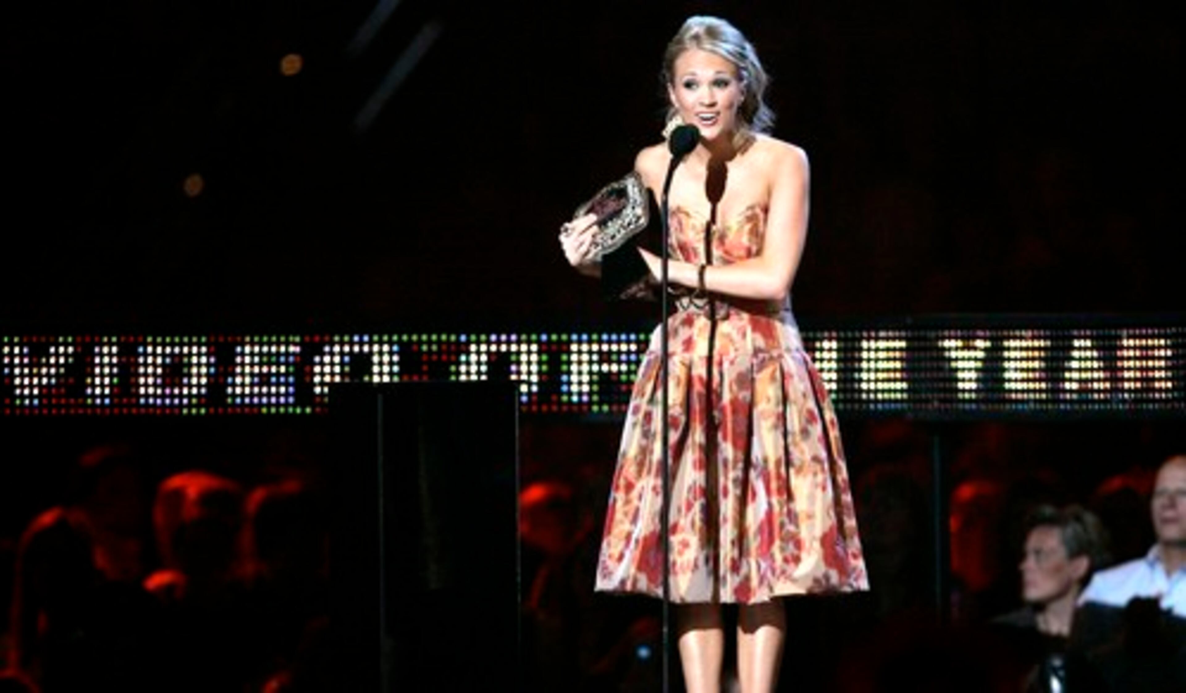 Carrie Underwood, accepting the video of the year award at the CMT Music Awards earlier this year, is a nominee for Country female artist, along with Taylor Swift and Martina McBride.