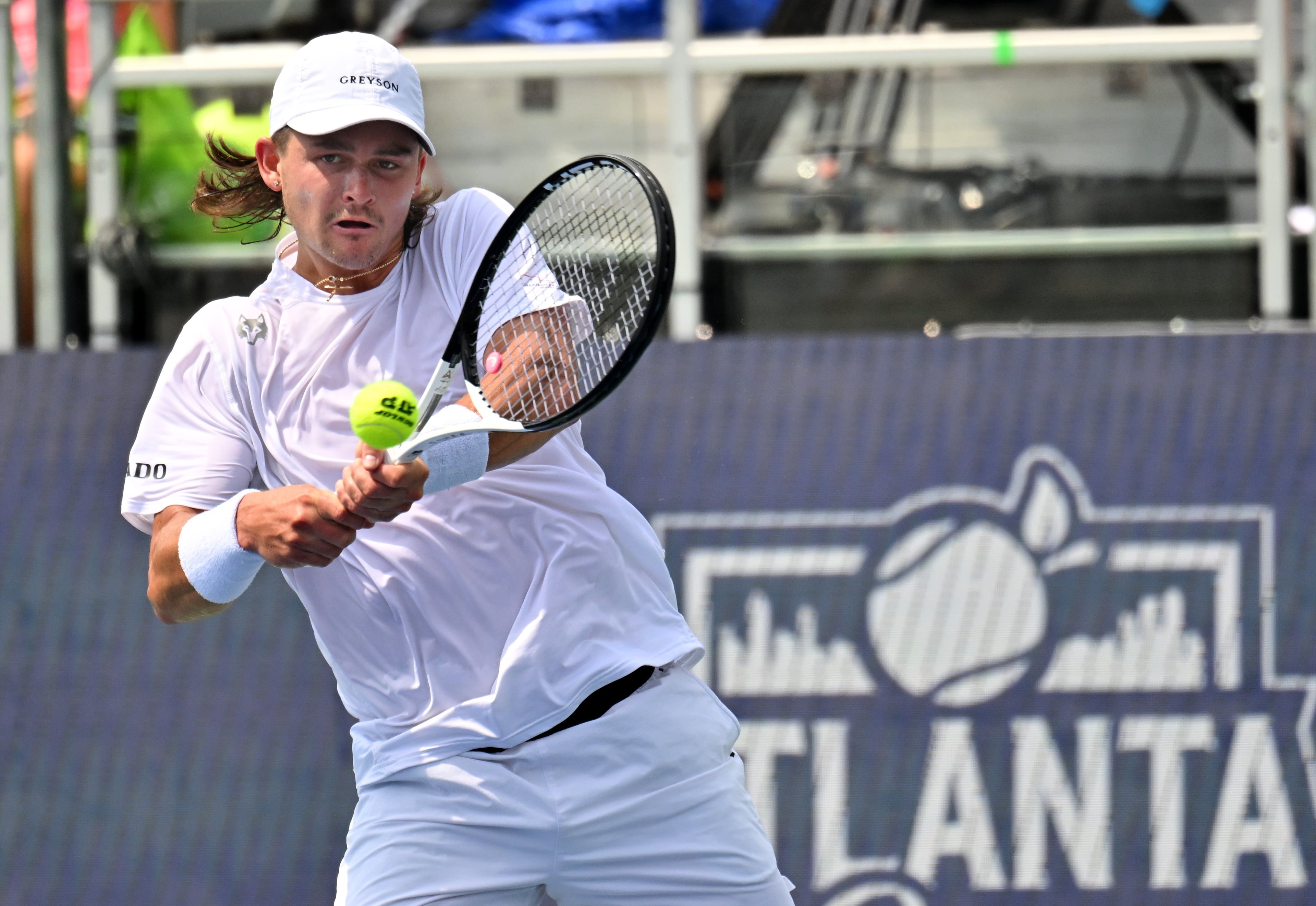 J.J. Wolf returns the ball to Taylor Fritz during a semifinal match at the 2023 Atlanta Tennis Open at Atlantic Station, Saturday, July 29, 2023, in Atlanta. (Hyosub Shin / Hyosub.Shin@ajc.com)