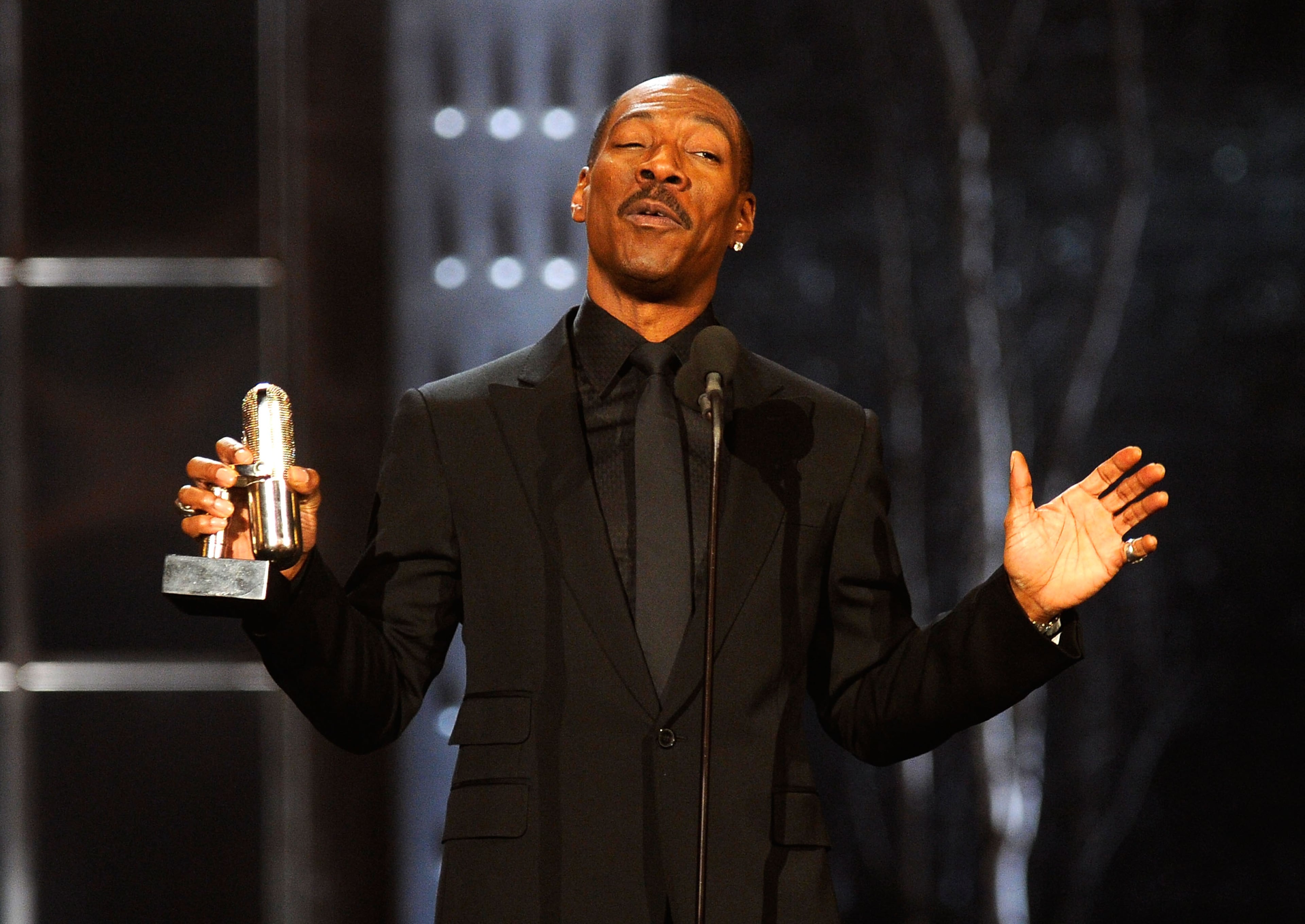 NEW YORK, NY - MARCH 26: Comedian Eddie Murphy speaks onstage at The First Annual Comedy Awards at Hammerstein Ballroom on March 26, 2011 in New York City. (Photo by Dimitrios Kambouris/Getty Images)