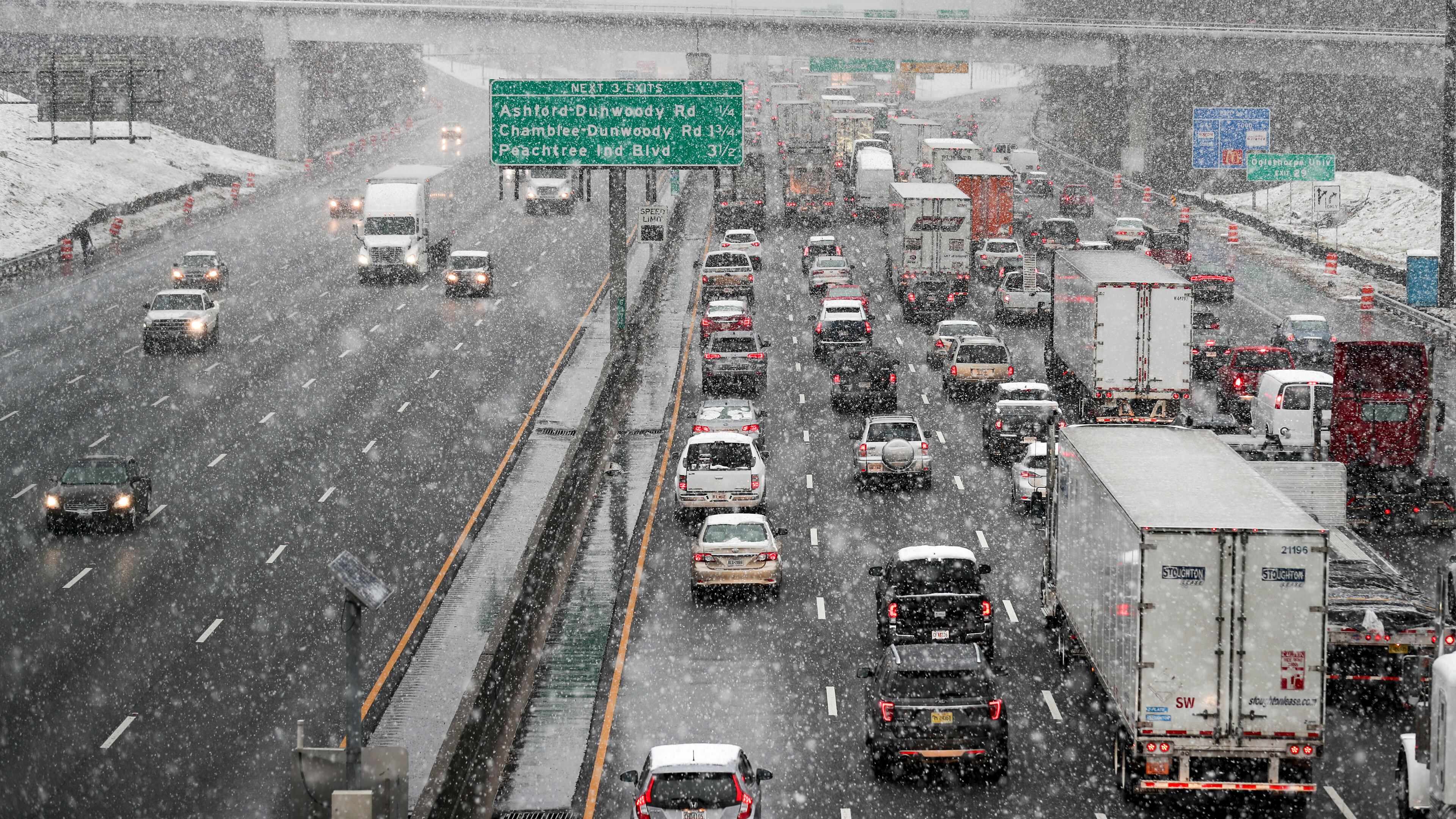 State transportation officials say last Friday's winter storm traffic jam was caused by high traffic volume - not poor road conditions. ALYSSA POINTER/ALYSSA.POINTER@AJC.COM