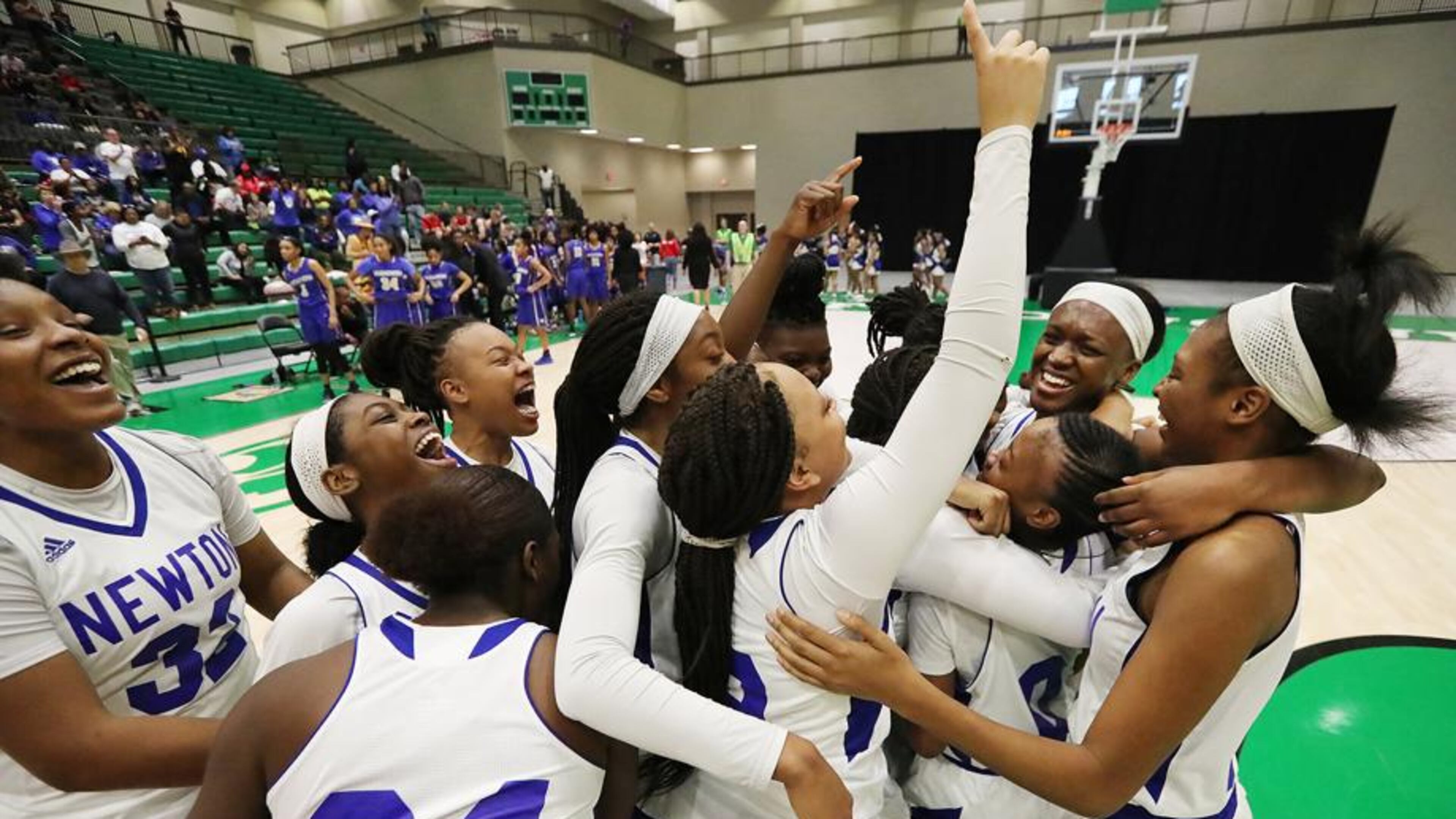 Newton’s girls celebrate their semifinal victory over McEachern in the Class AAAAAAA semifinals in Buford. They overcome an 18-point deficit. Newton is in the finals for the first time since 1963.