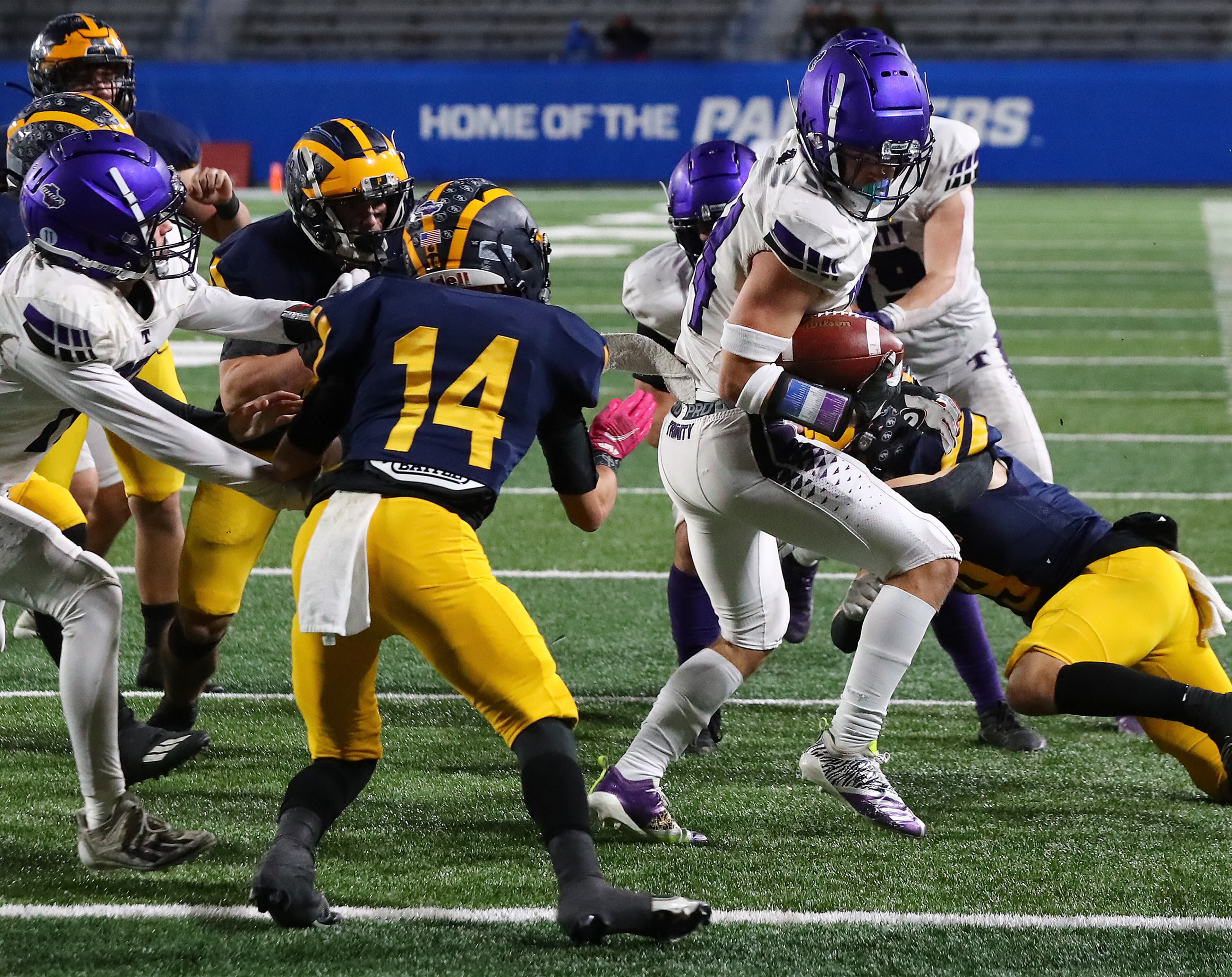 Trinity Christian slotback Bryce Wilcox backs his way into the end zone for a touchdown to take a 42-7 lead over Prince Avenue Christian during the third quarter in their GHSA Class A Private Championship game on Thursday, Dec 9, 2021, in Atlanta. “Curtis Compton / Curtis.Compton@ajc.com”`