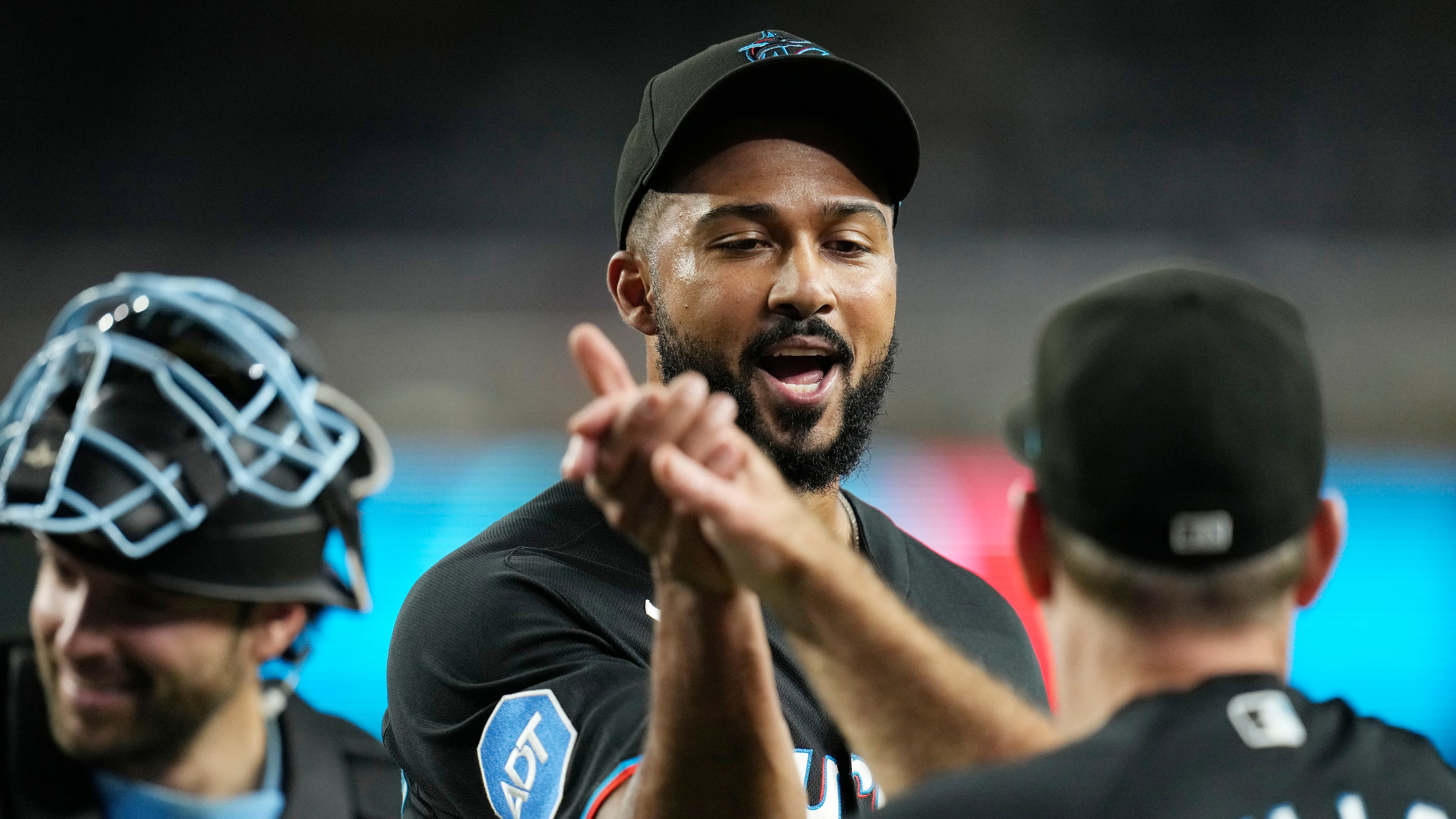 Miami Marlins pitcher Sandy Alcantara, left, celebrates a win against the Arizona Diamondbacks with Marlins manager Clayton McCullough after a baseball game, Wednesday, Sept. 16, 2026, in Phoenix. (AP Photo/Ross D. Franklin)
