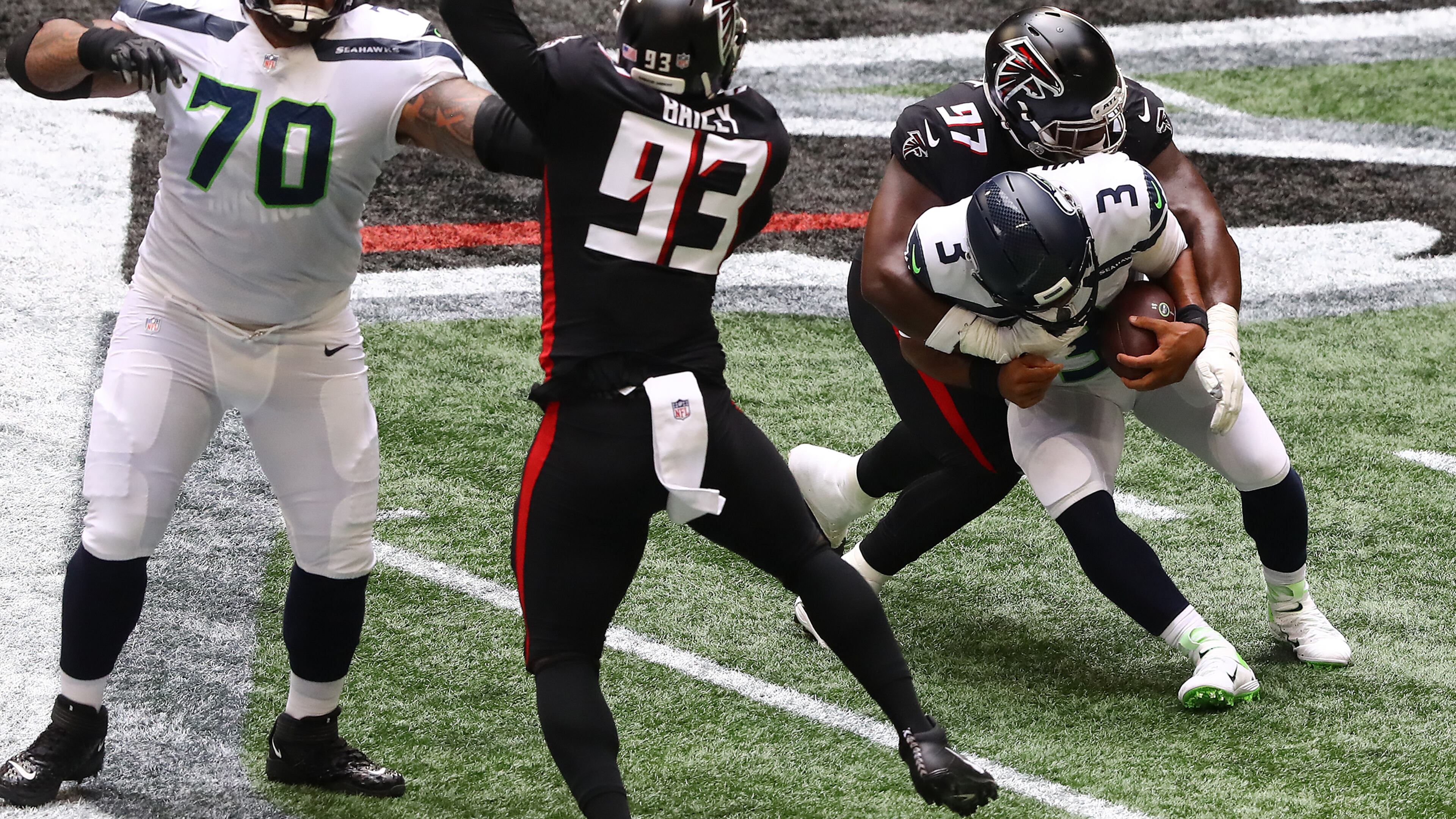 091320 Atlanta: Atlanta Falcons defensive tackle Grady Jarrett sacks Seattle Seahawks quarterback Russel Wilson during the first half Sunday, Sept. 13, 2020, in Atlanta. (Curtis Compton / Curtis.Compton@ajc.com)
