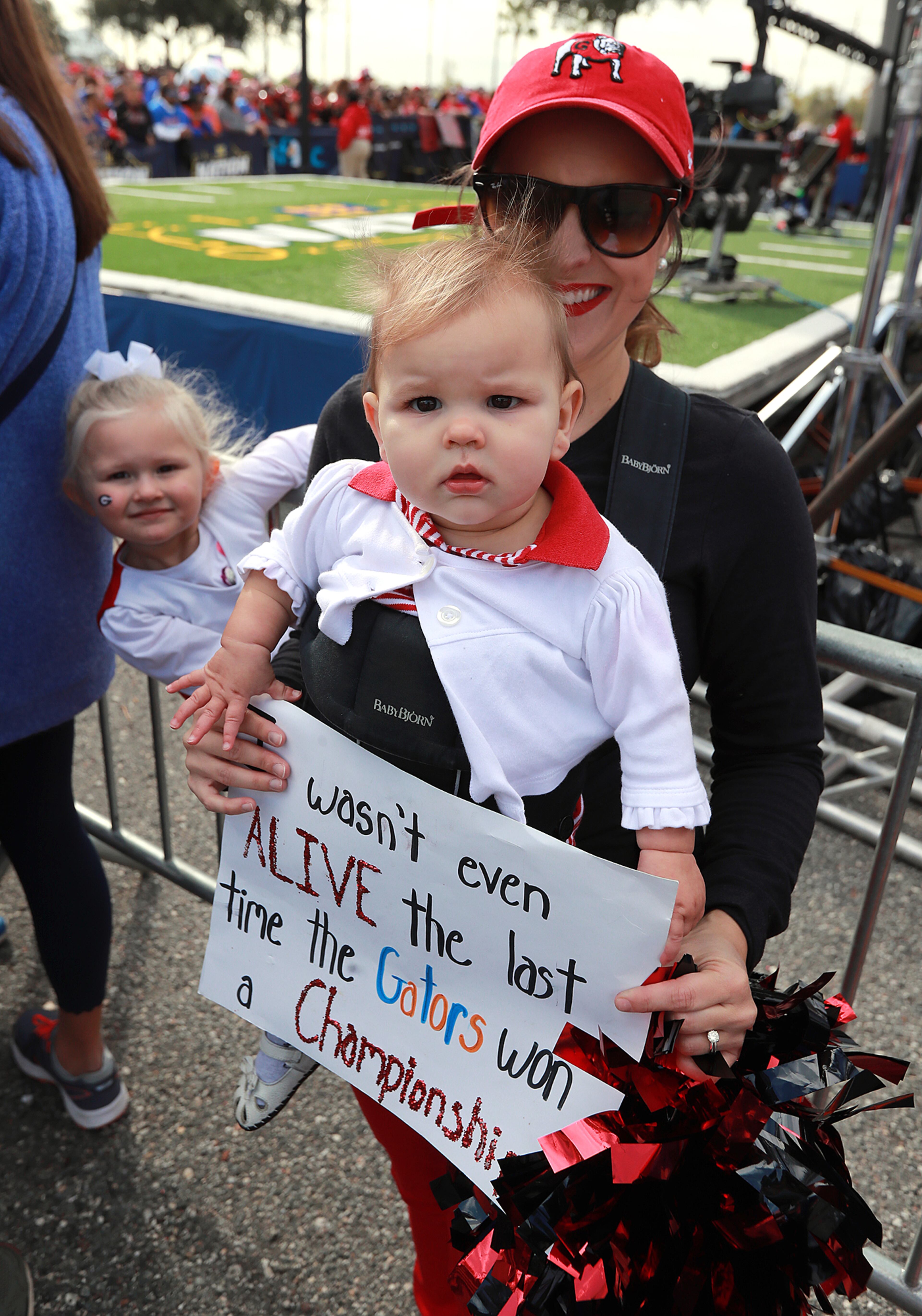 Amand Minton and her 10-month-old daughter Maris arrive for her very first Georgia-Florida game on Saturday, November 2, 2019, in Jacksonville. Curtis Compton/ccompton@ajc.com