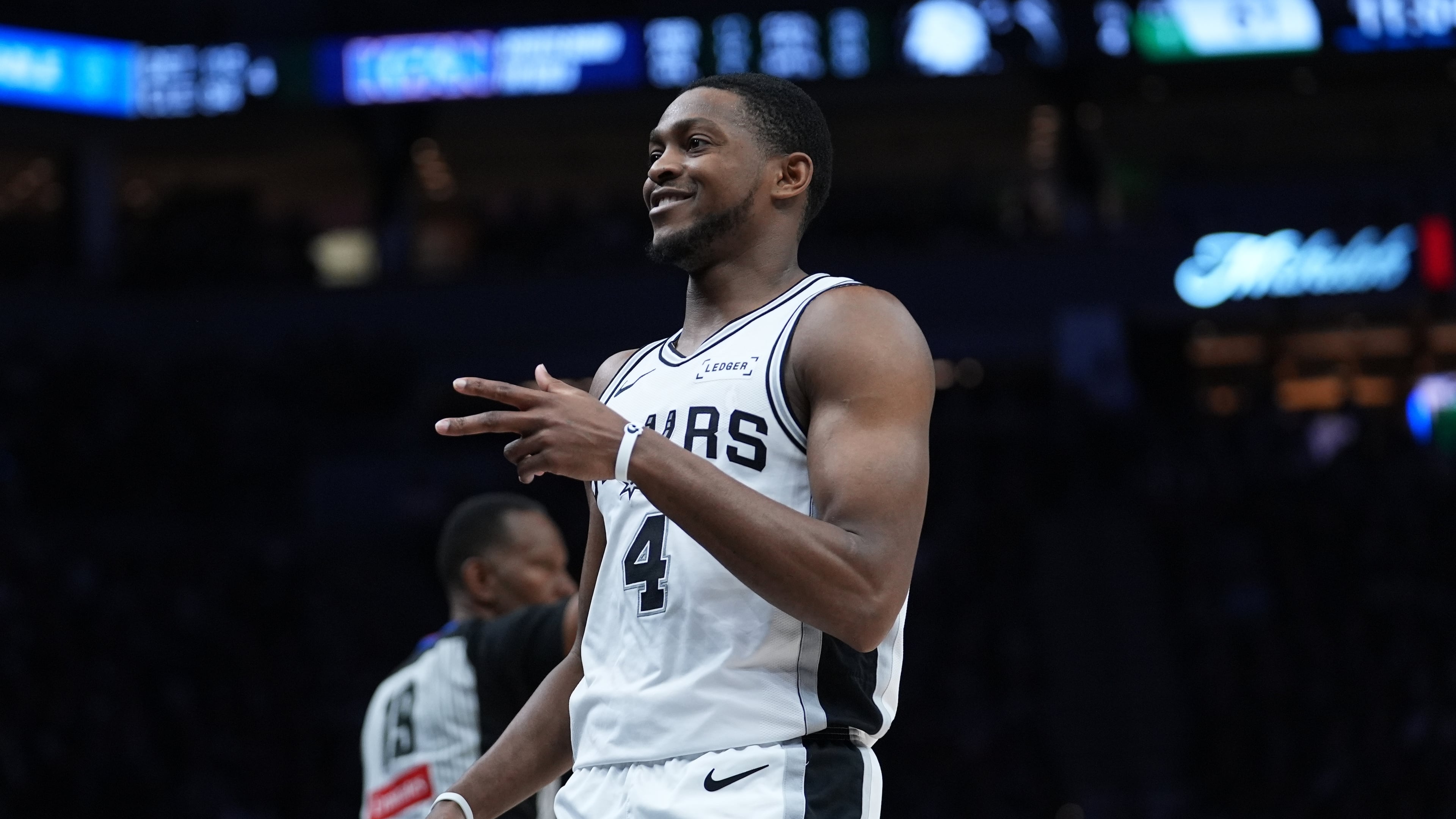 San Antonio Spurs guard De'aaron Fox (4) reacts after scoring against the Minnesota Timberwolves during the second half of Game 6 of an NBA basketball second-round playoffs series in Minneapolis, Friday, May 15, 2026. (AP Photo/Abbie Parr)