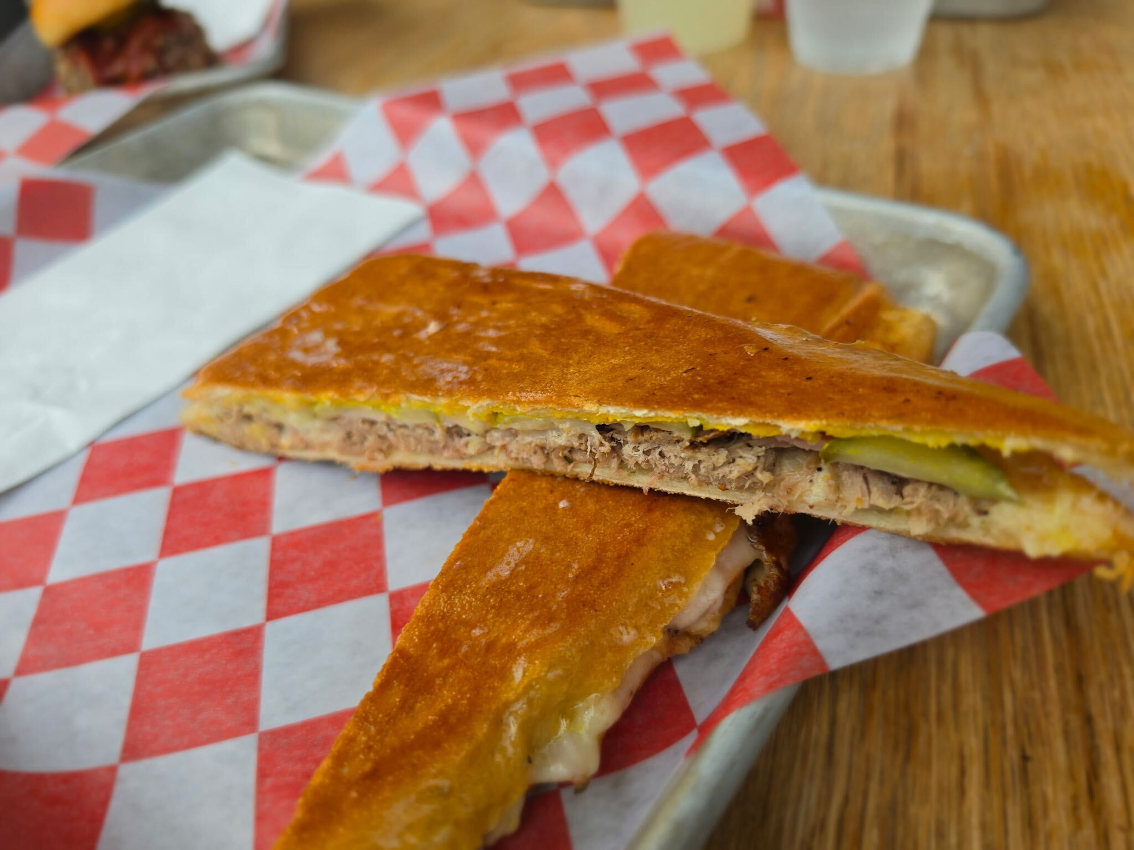 Smoked pork, mojo mayo and authentic Cuban bread work perfectly together to create the Miami Sami, available at Sammy’s in Adair Park. (Justin Brown for the AJC)