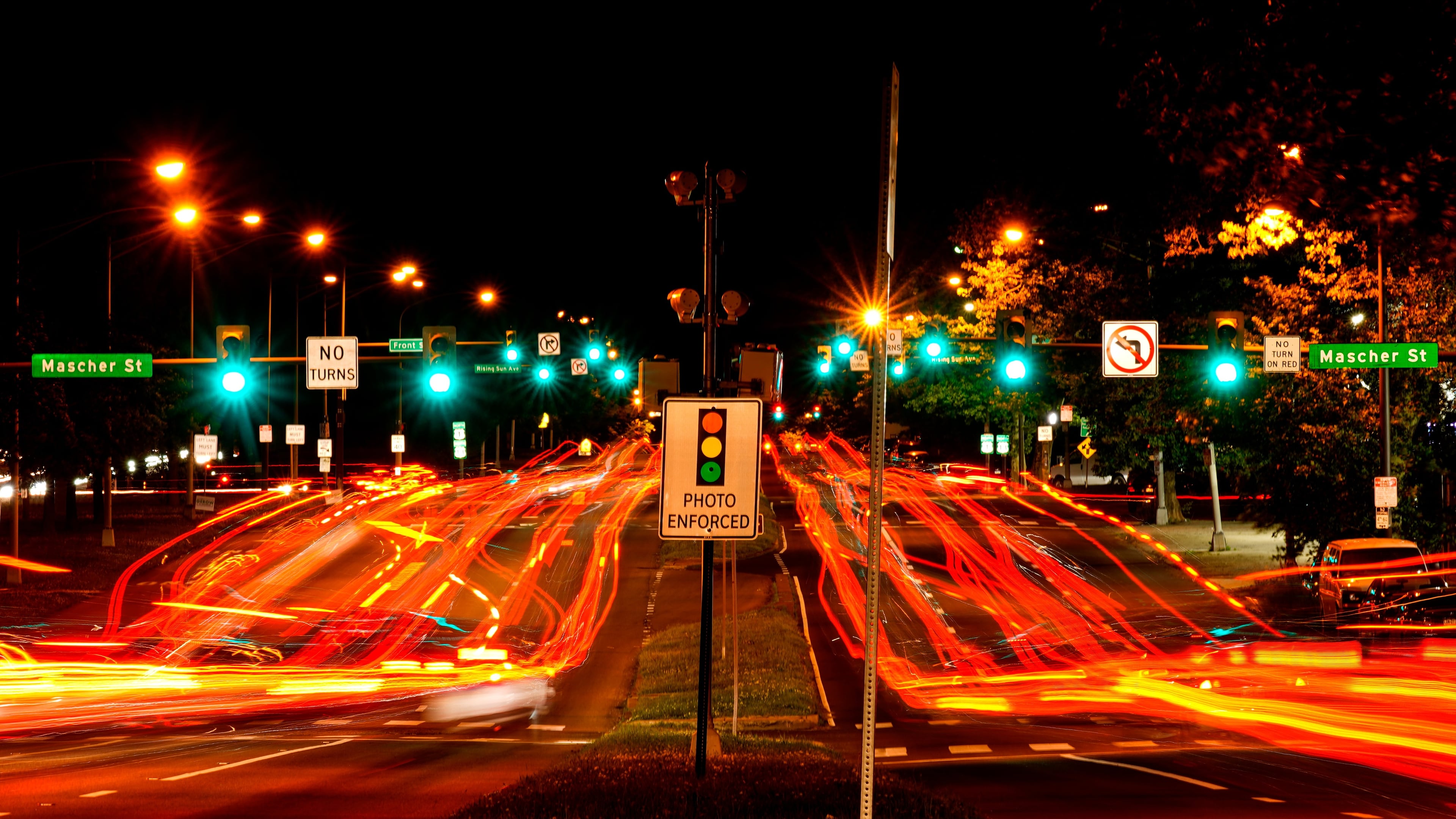 FILE - This long exposure photo shows traffic driving on Roosevelt Boulevard in Philadelphia, May 25, 2022. (AP Photo/Matt Rourke, File)