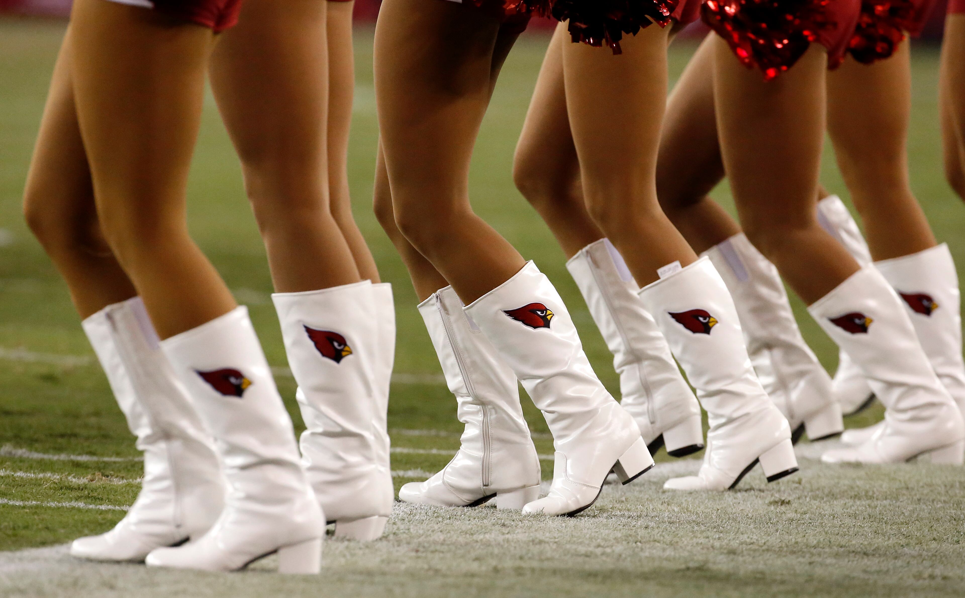 The Arizona Cardinals cheerleaders perform during the second half of an NFL preseason football game against the Houston Texans, Saturday, Aug. 9, 2014, in Glendale, Ariz. (AP Photo/Matt York)