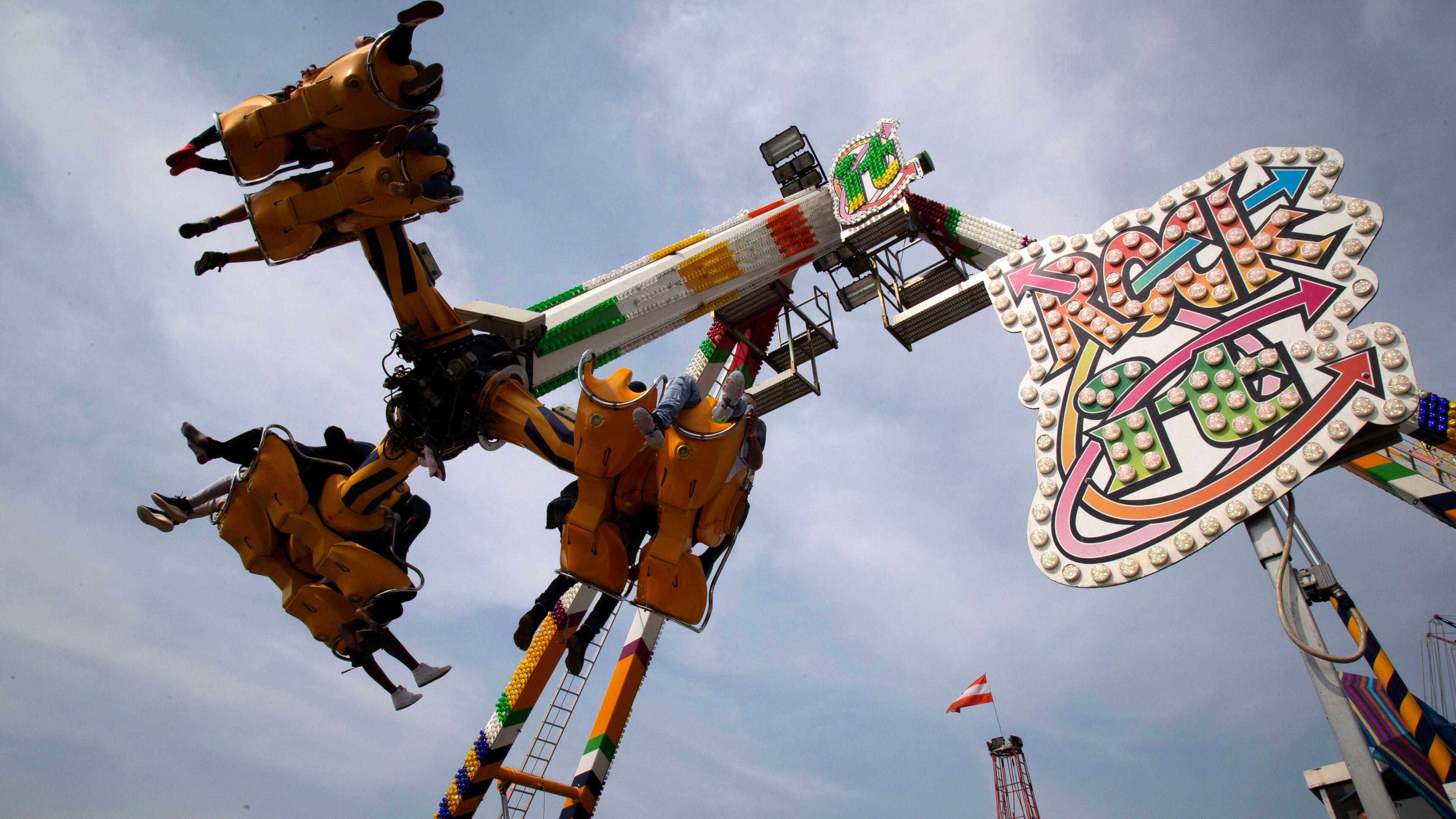 Fairgoers ride the Rock It, one of the rides at the Georgia State Fair at the Atlanta Motor Speedway Sunday, October 4, 2020. STEVE SCHAEFER / SPECIAL TO THE AJC