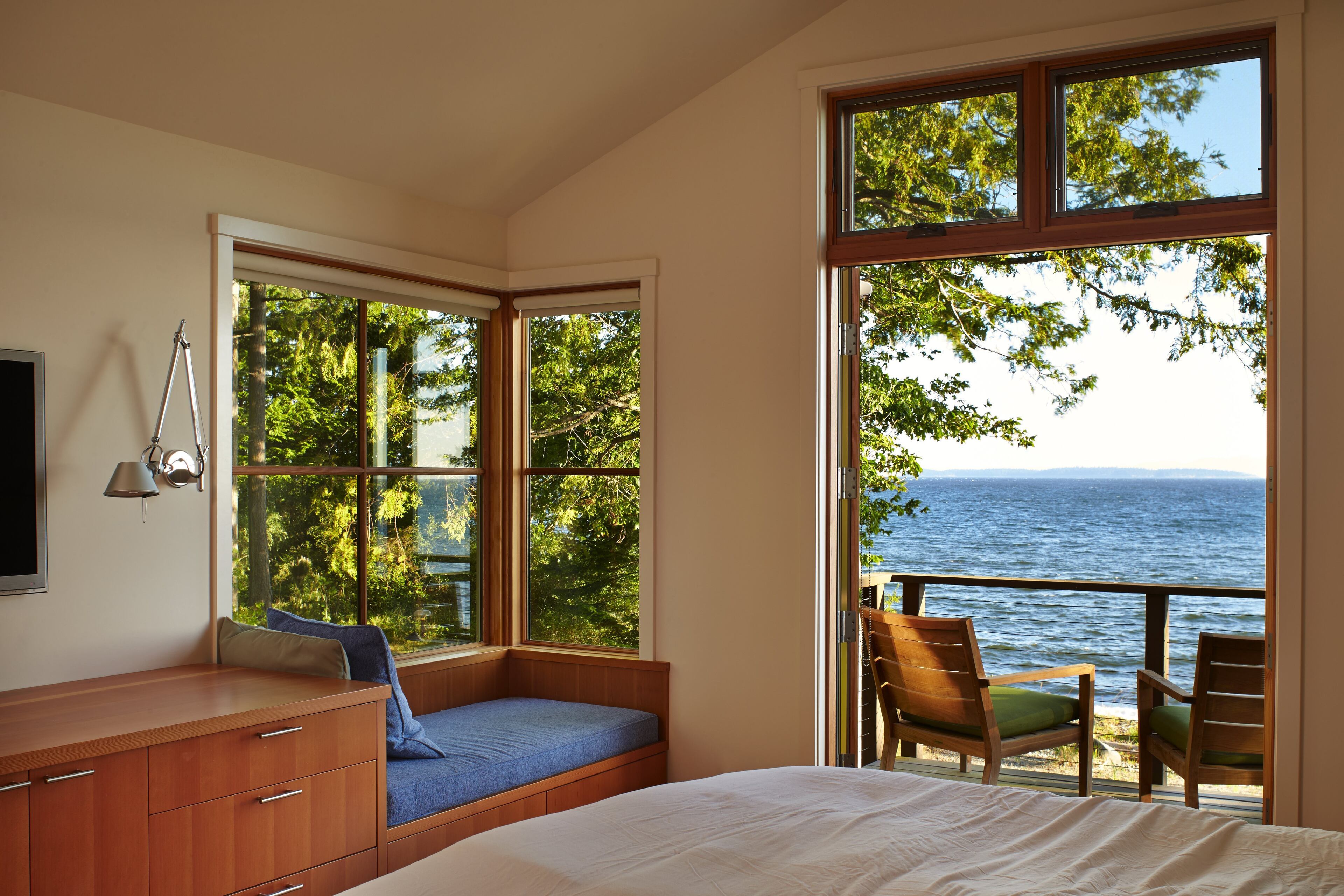 The master bedroom, with its own built-ins, opens to the beach and the forest. (Benjamin Benschneider/Seattle Times/MCT)