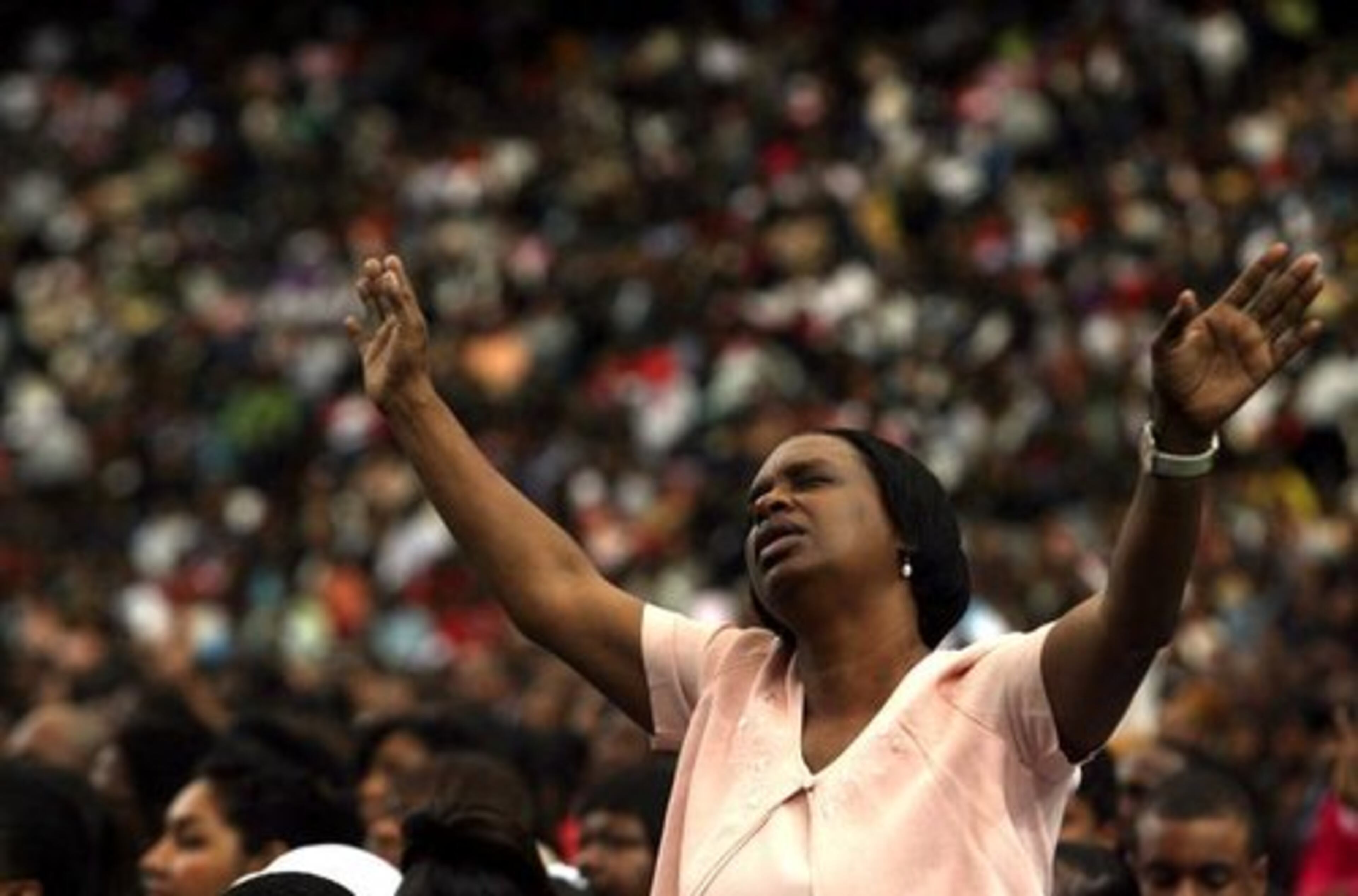 A worshiper celebrates Easter at the New Birth service.