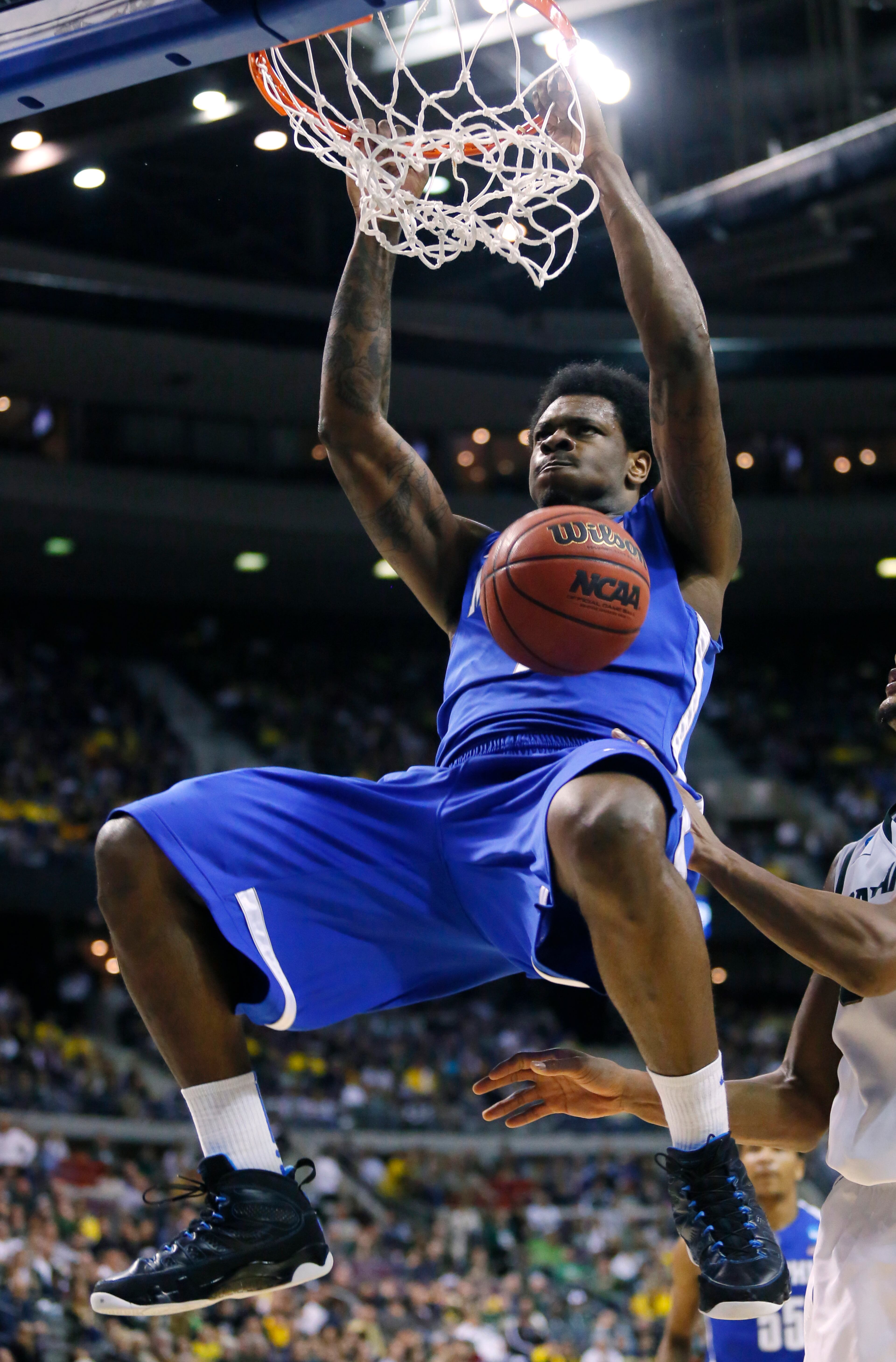 Memphis forward Tarik Black dunks against Michigan State in the second half of a third-round game of the NCAA college basketball tournament Saturday, March 23, 2013, in Auburn Hills, Mich. Michigan State defeated Memphis 70-48. (AP Photo/Duane Burleson)