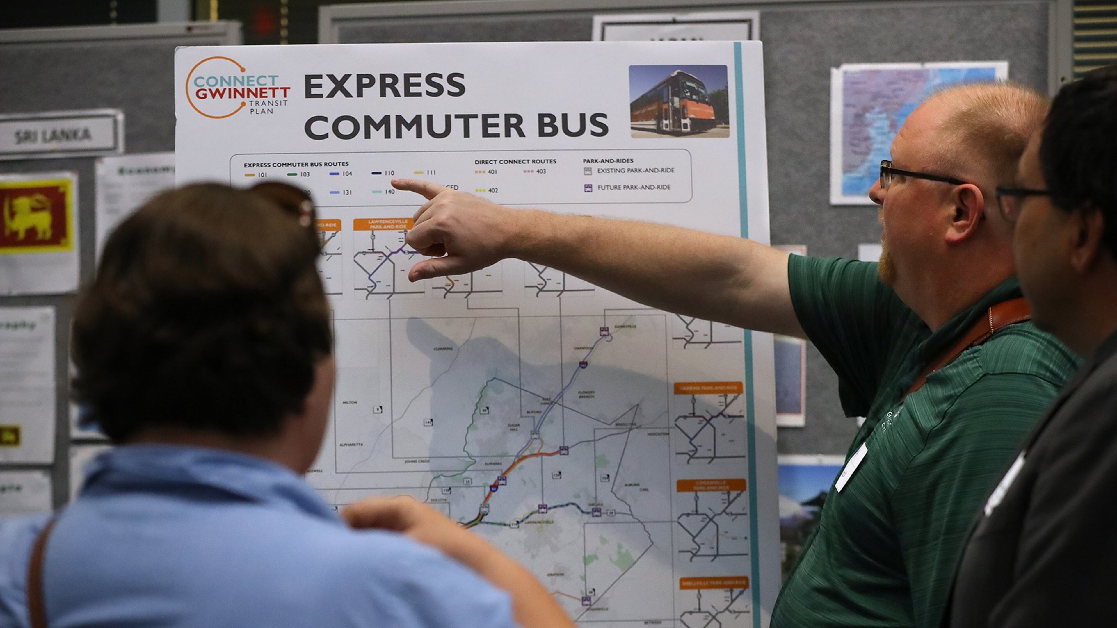 Jessica & Derek Behmke, Lawrenceville, look over one of the displays during a Gwinnett County information session on it’s proposed transit plan at the Gwinnett Justice and Administrative Center oin Lawrenceville. Among other things, the plan calls for a MARTA rail extension to Norcross and new bus rapid transit lines. Curtis Compton/ccompton@ajc.com