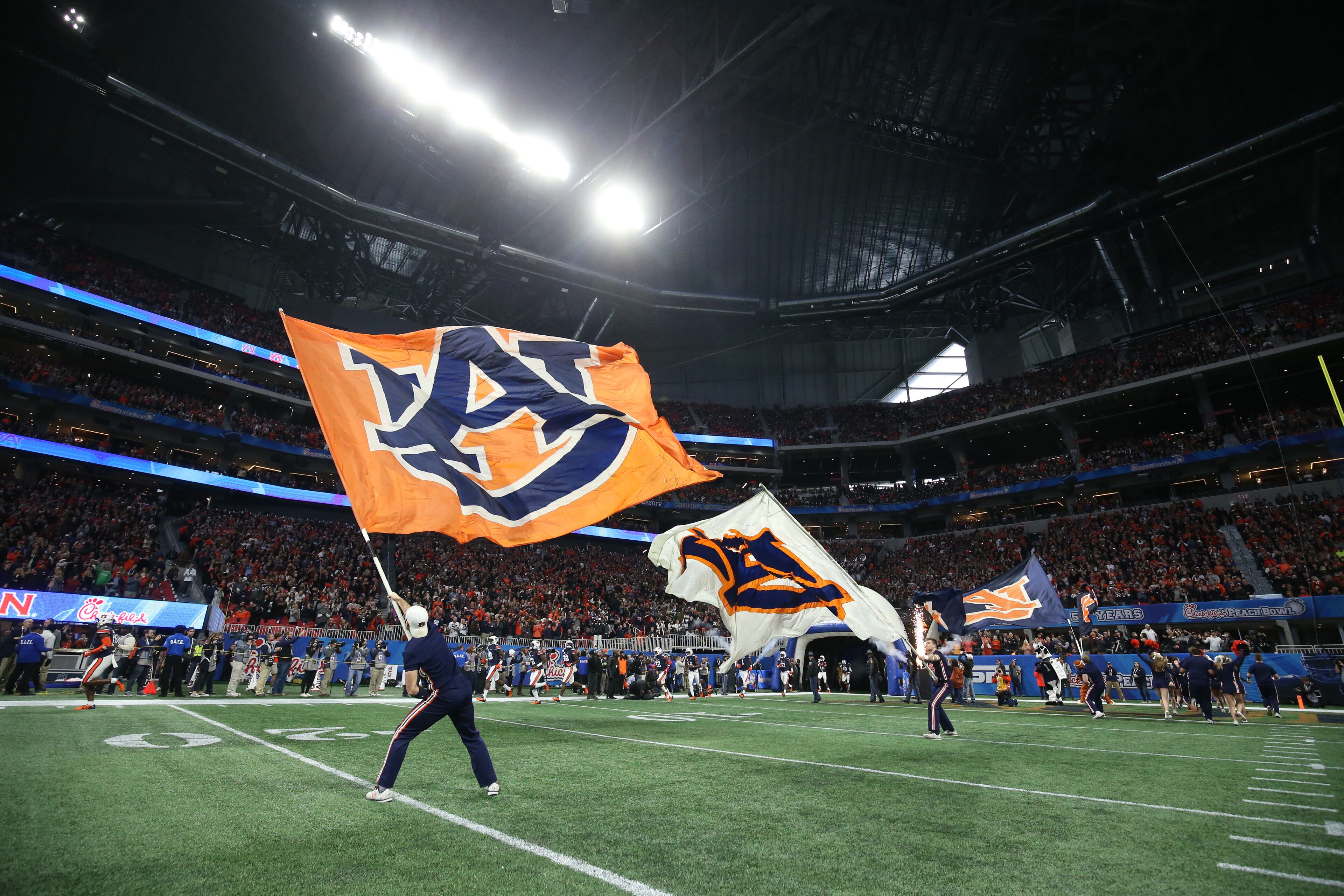 January 1, 2018 - Atlanta, Ga: Auburn Tigers wave flags before Auburn's game against the UCF Knights during the Chick-fil-a Peach Bowl at the Mercedes-Benz Stadium Monday, January 1, 2018, in Atlanta. PHOTO / JASON GETZ