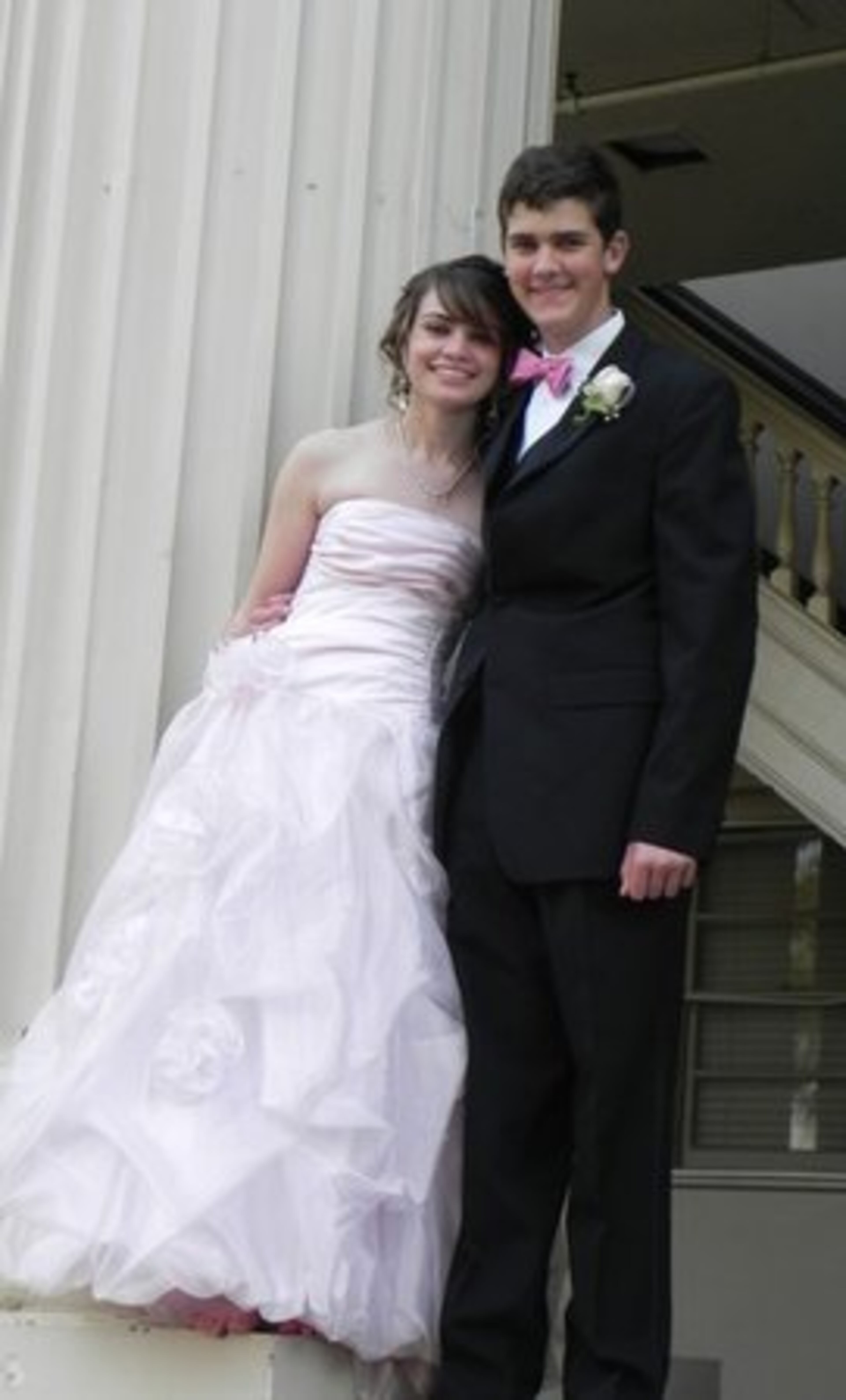 Katie Johnson and Casey Carrell are all smiles as they pose at UGA North Campus before the George Walton Academy Prom.