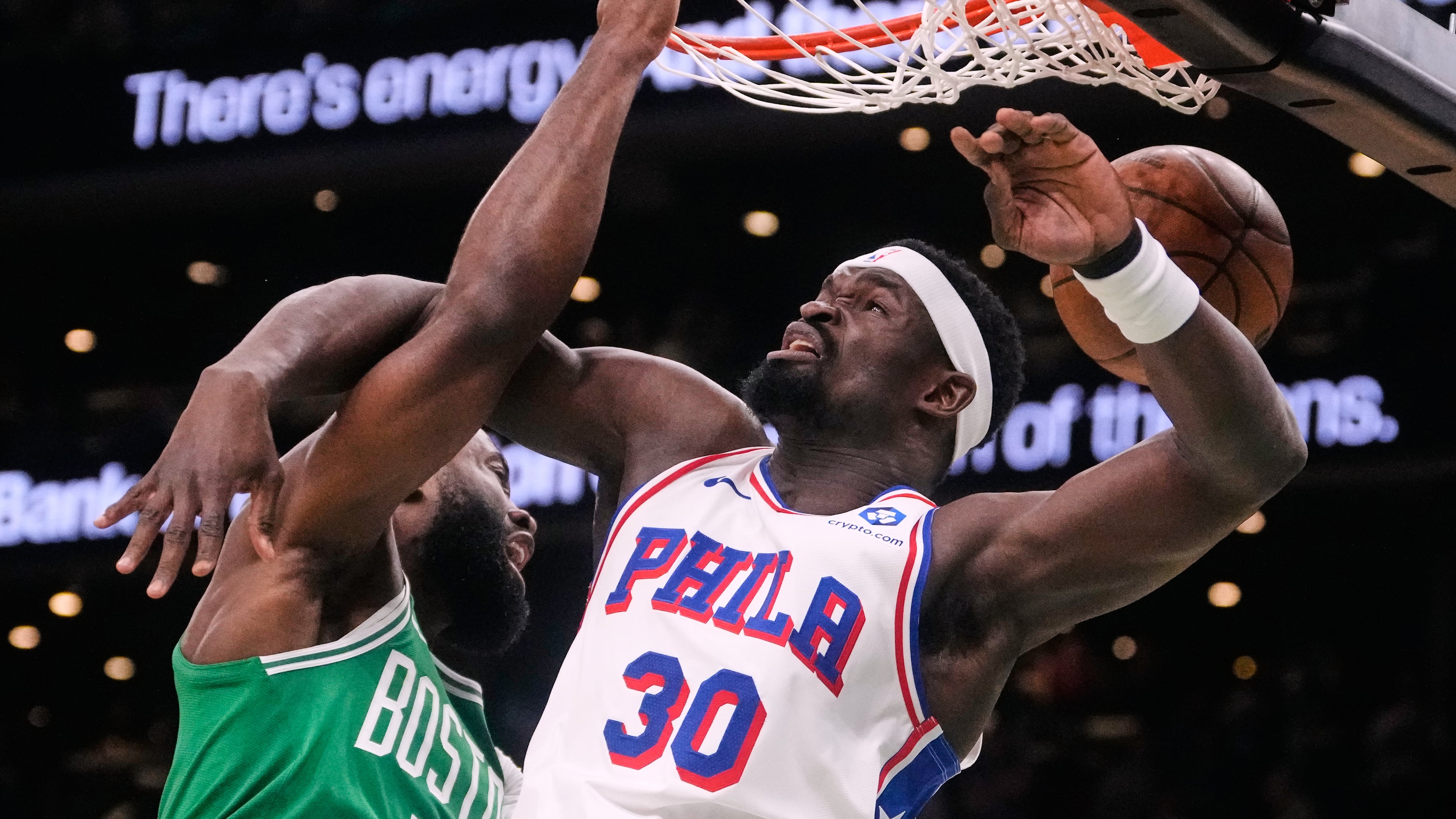 Boston Celtics guard Jaylen Brown (7) slams a dunk against Philadelphia 76ers center Adem Bona (30) during the first half of Game 2 of a first-round NBA playoffs basketball game, Tuesday, April 21, 2026, in Boston. (AP Photo/Charles Krupa)
