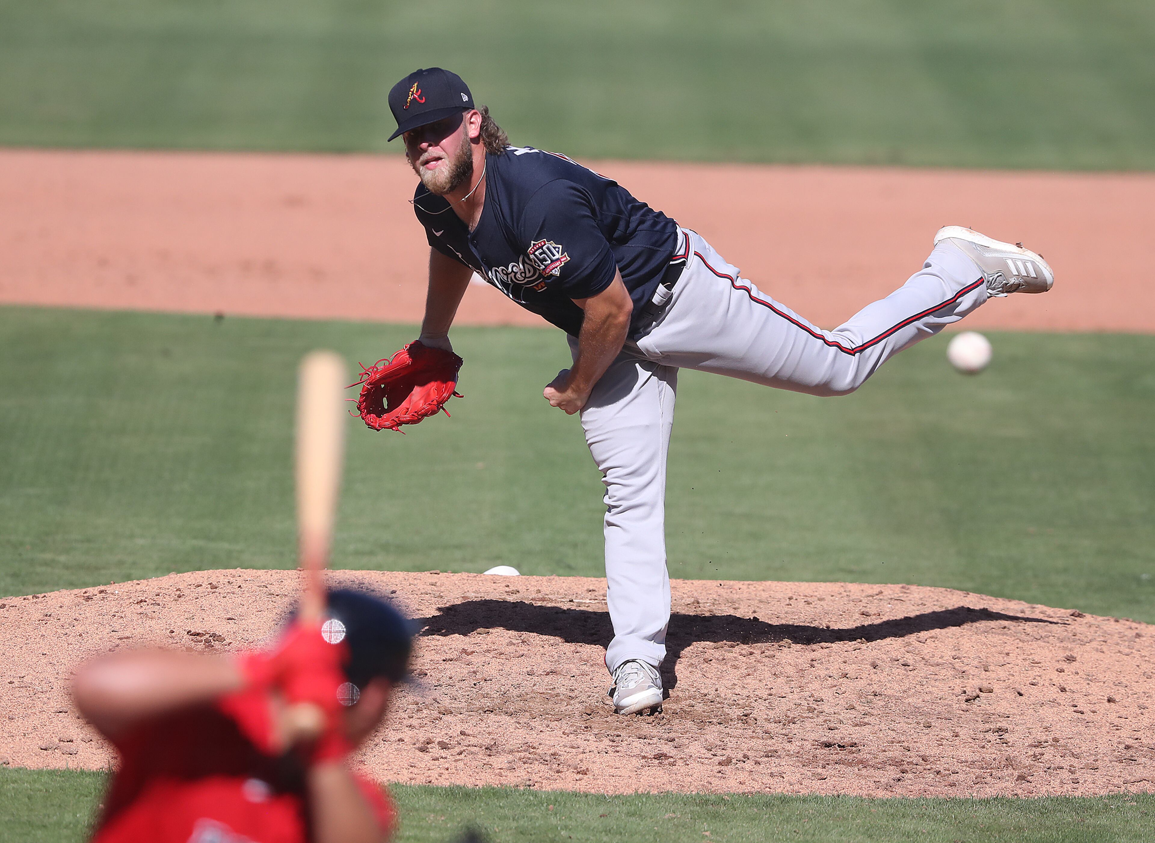 Atlanta Braves reliever A.J. Minter delivers against the Boston Red Sox during the fifth inning Monday, March 1, 2021, at JetBlue Park in Fort Myers, Fla. (Curtis Compton / Curtis.Compton@ajc.com)