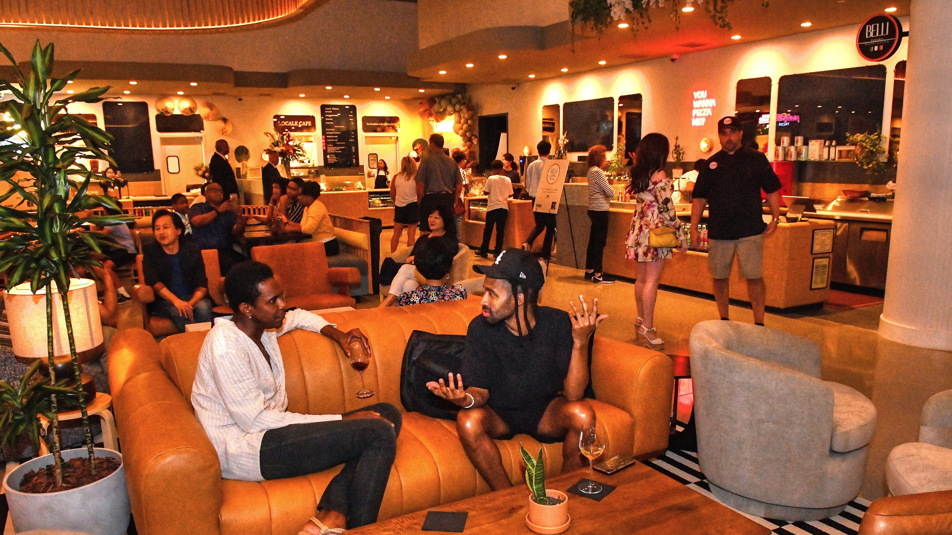 The dining area of the new Politan Row at Colony Square in Atlanta features nontraditional "food court" eating areas, including soft seating and a central bar. (Chris Hunt for The Atlanta Journal-Constitution)