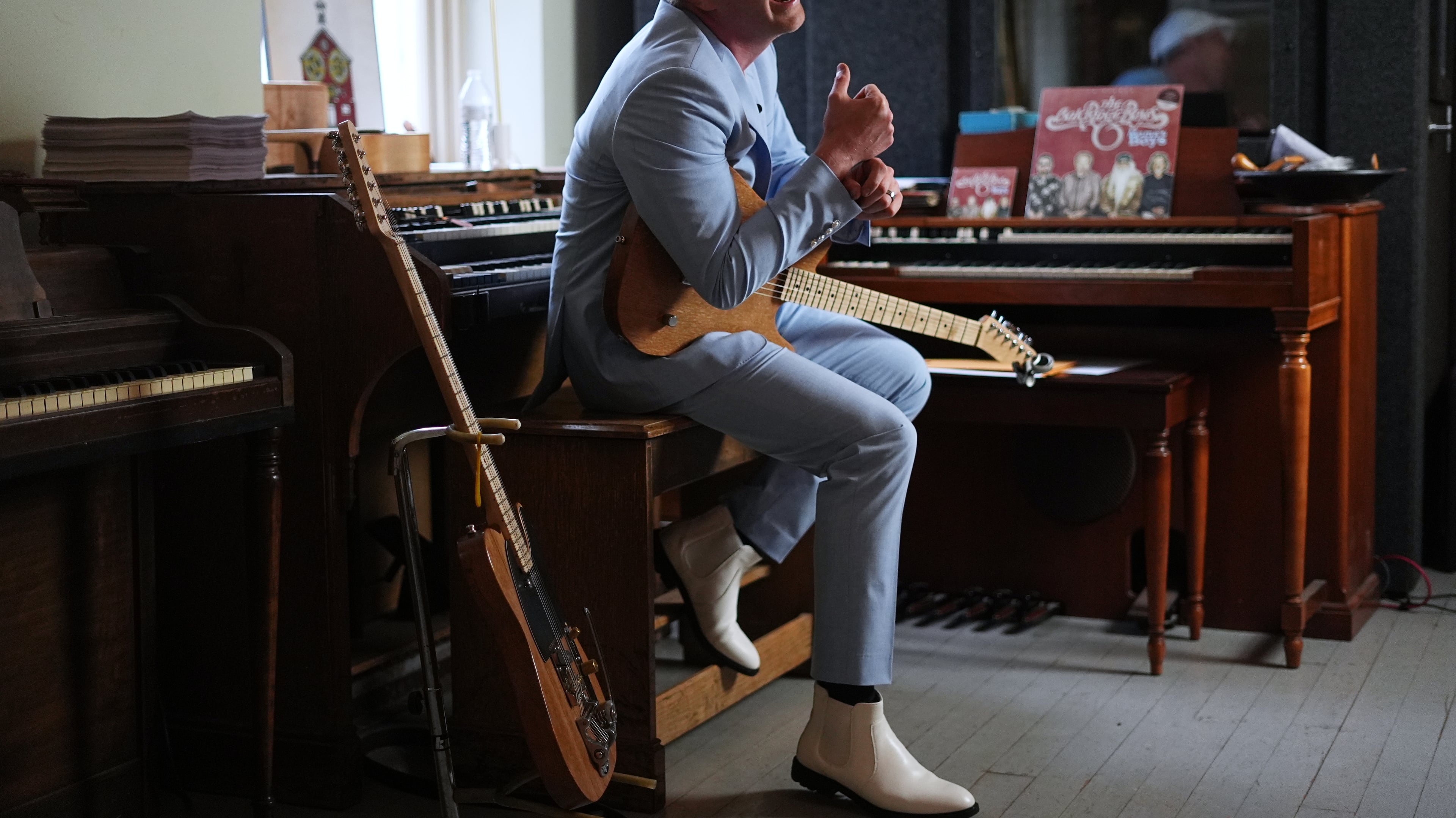 Conrad Fisher laughs during an interview with the Associated Press ahead of his performance at Ragamuffin Hall in McCoysville, Pa., Saturday, April 25, 2026. (AP Photo/Matt Rourke)