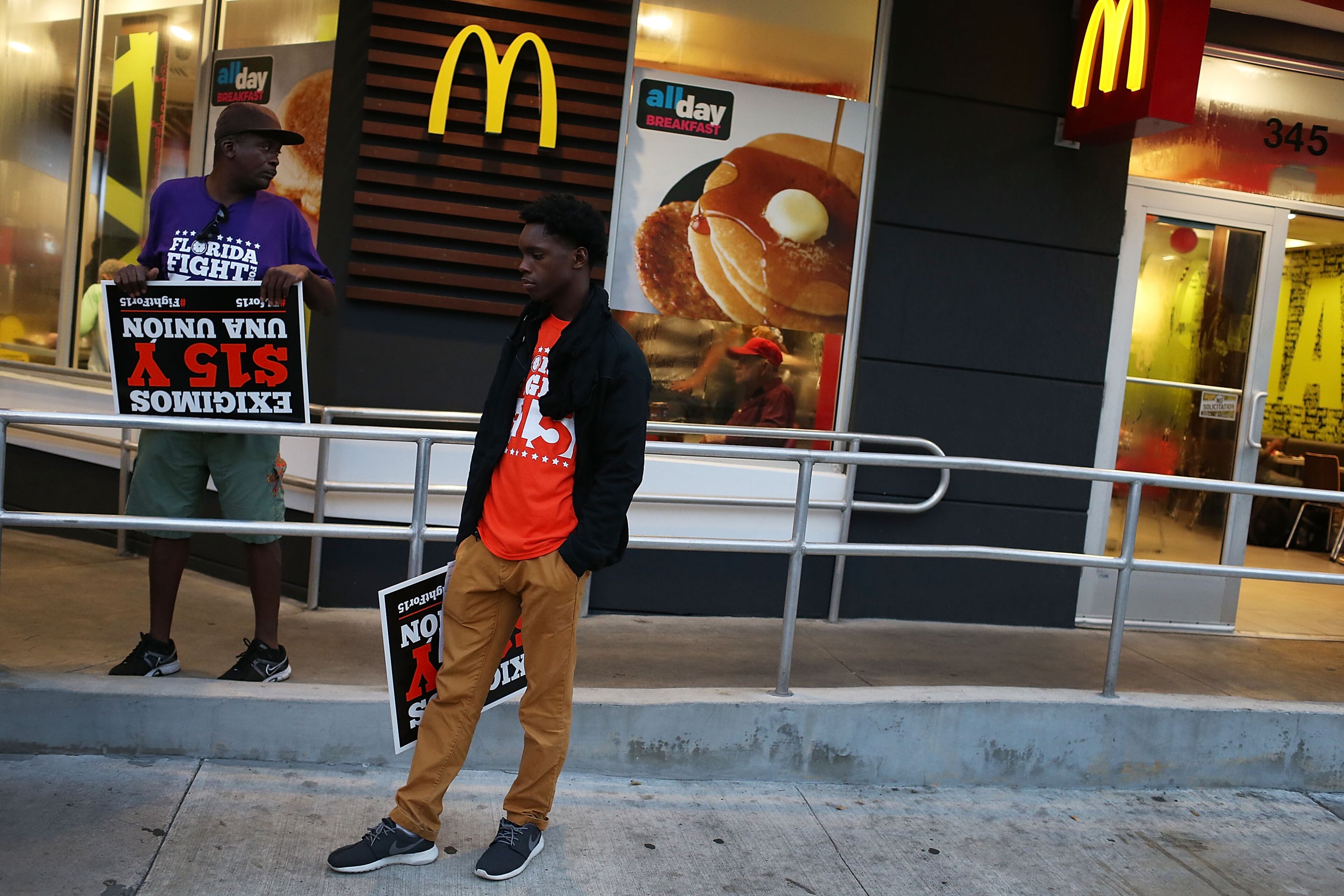 MIAMI, FL - NOVEMBER 10: Workers protest outside a McDonald's restaurant on November 10, 2015 in Miami, Florida. The protesters are demanding action from state legislators and presidential candidates to raise the minimum wage to $15 an hour. (Photo by Joe Raedle/Getty Images)