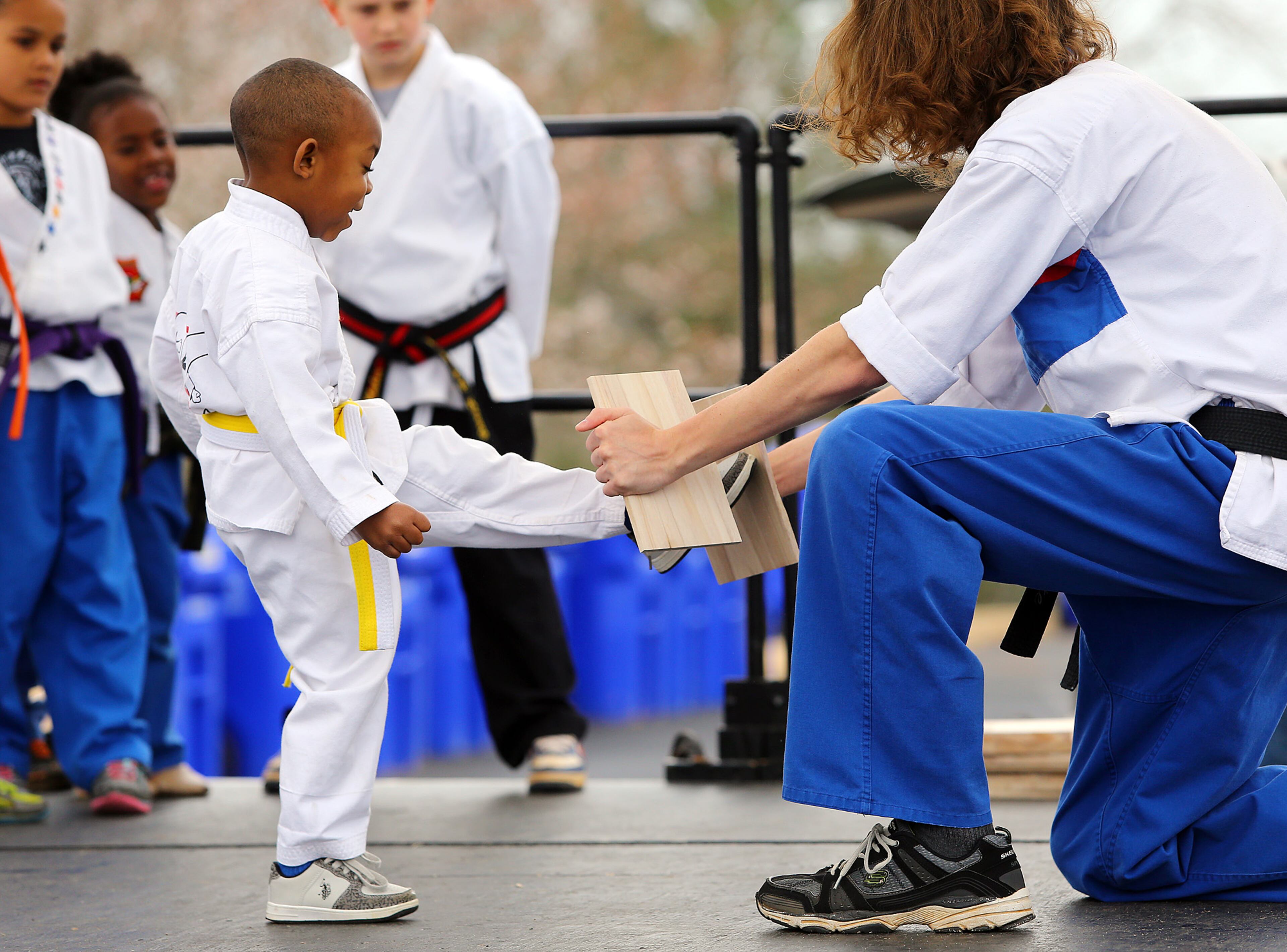 Three-year old Avery Westmoreland breaks a board in half during his martial arts demo with UMAS Karate at the 33rd Annual Conyers Cherry Blossom Festival on Sunday, March 23, 2014, in Conyers.