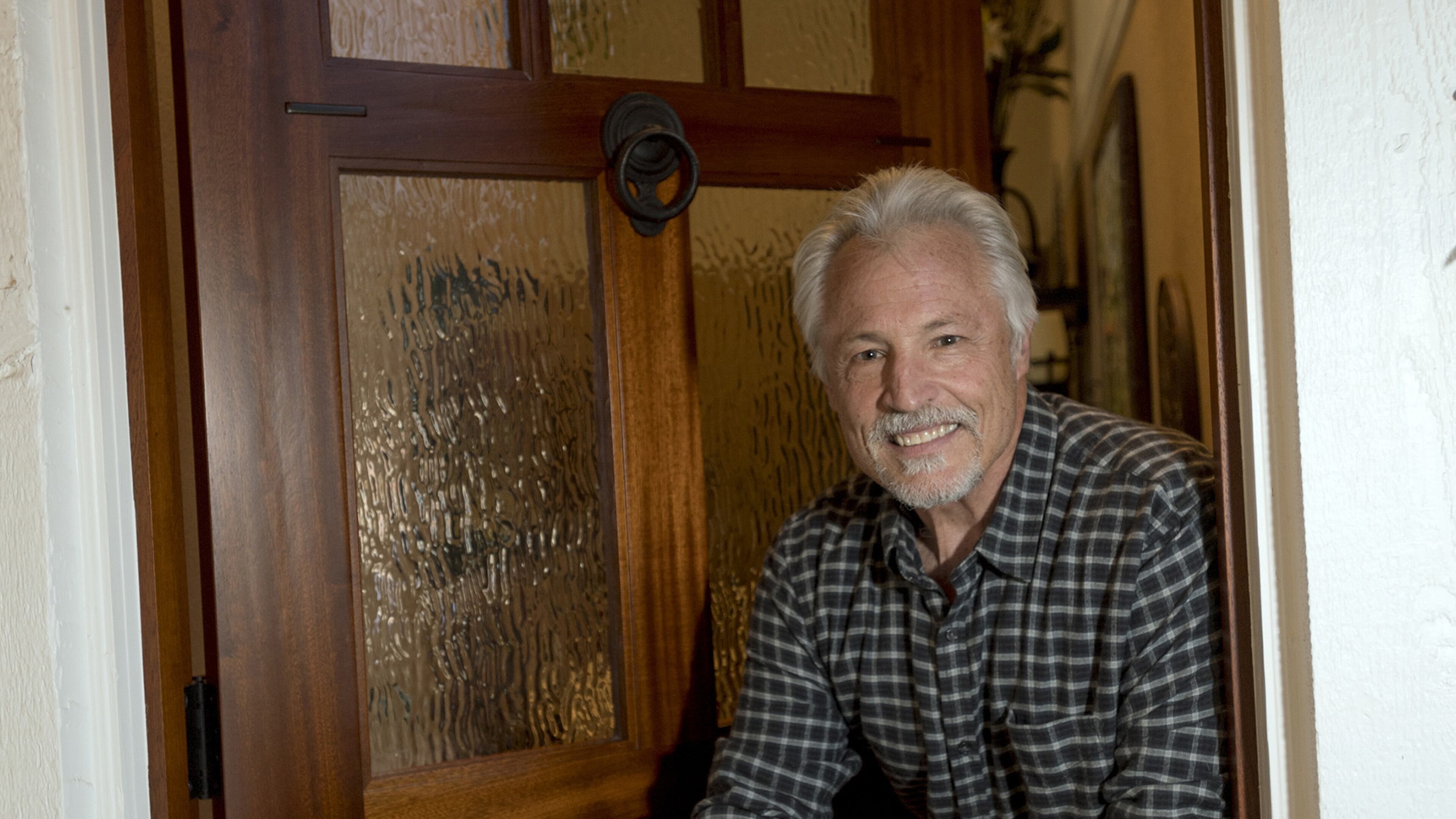 Ed Arthur, a custom refinisher, shows off the front door of his Irvine home on Jan. 17, 2017. (Jeff Gritchen/Orange County Register/TNS)